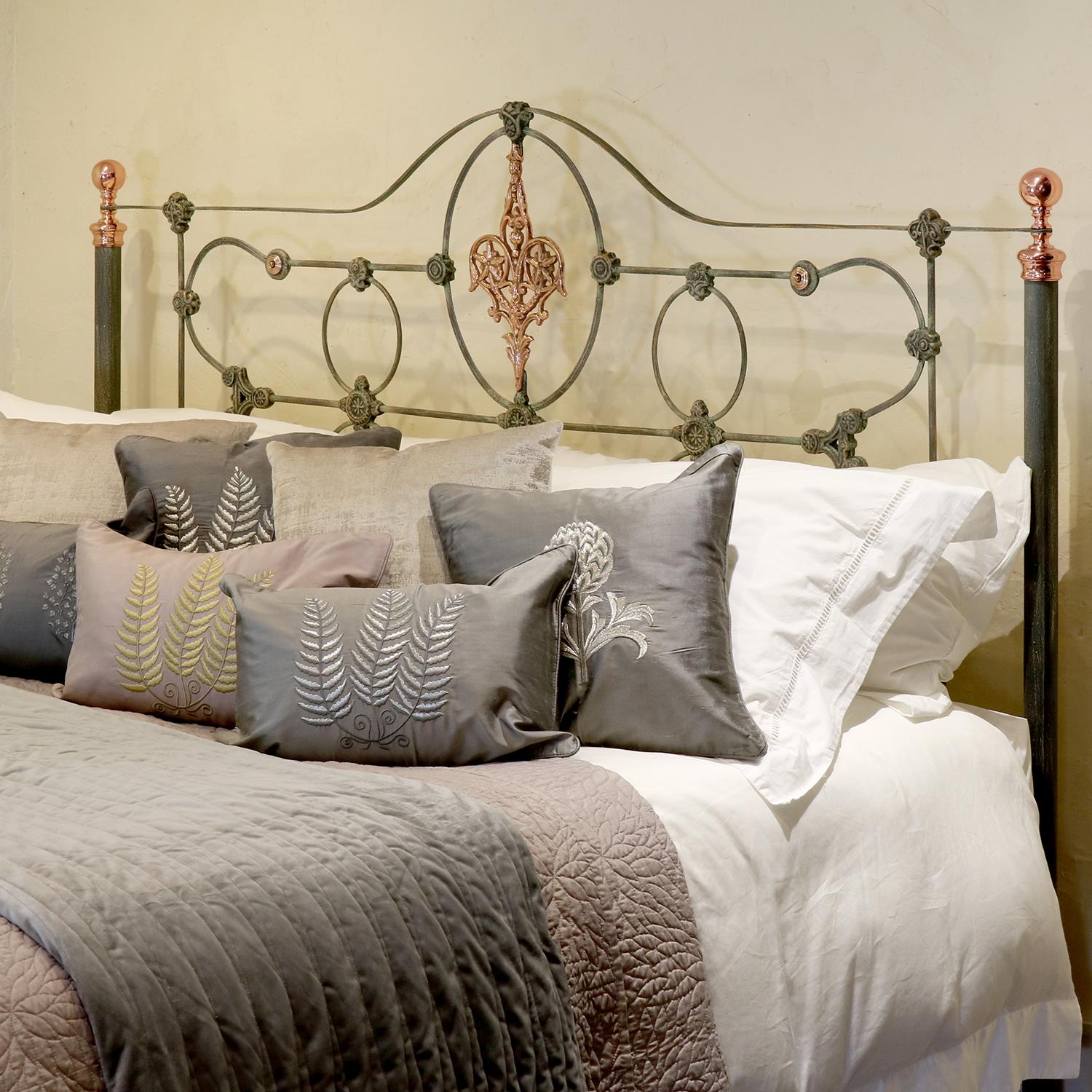 Extra wide cast iron and brass platform/low end bed in one of our new hand painted finishes. This bed also has our unique copper plated brass finials, plaque and rosettes making this a stunning addition to your home. Adapted from a Victorian frame,