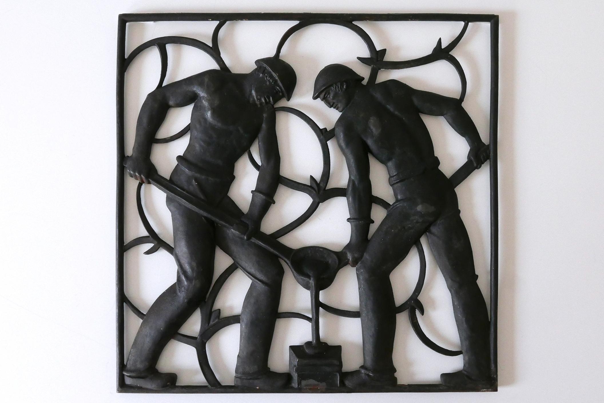 Amazing and highly decorative wall relief by Heinrich Moshage (1896-1968), 1929. Cast by the foundry 'Buderus', Germany, 1930s.
This piece is part of a series of six works 'Unsere Arbeit', each portraying vignettes of everyday life.

Executed in