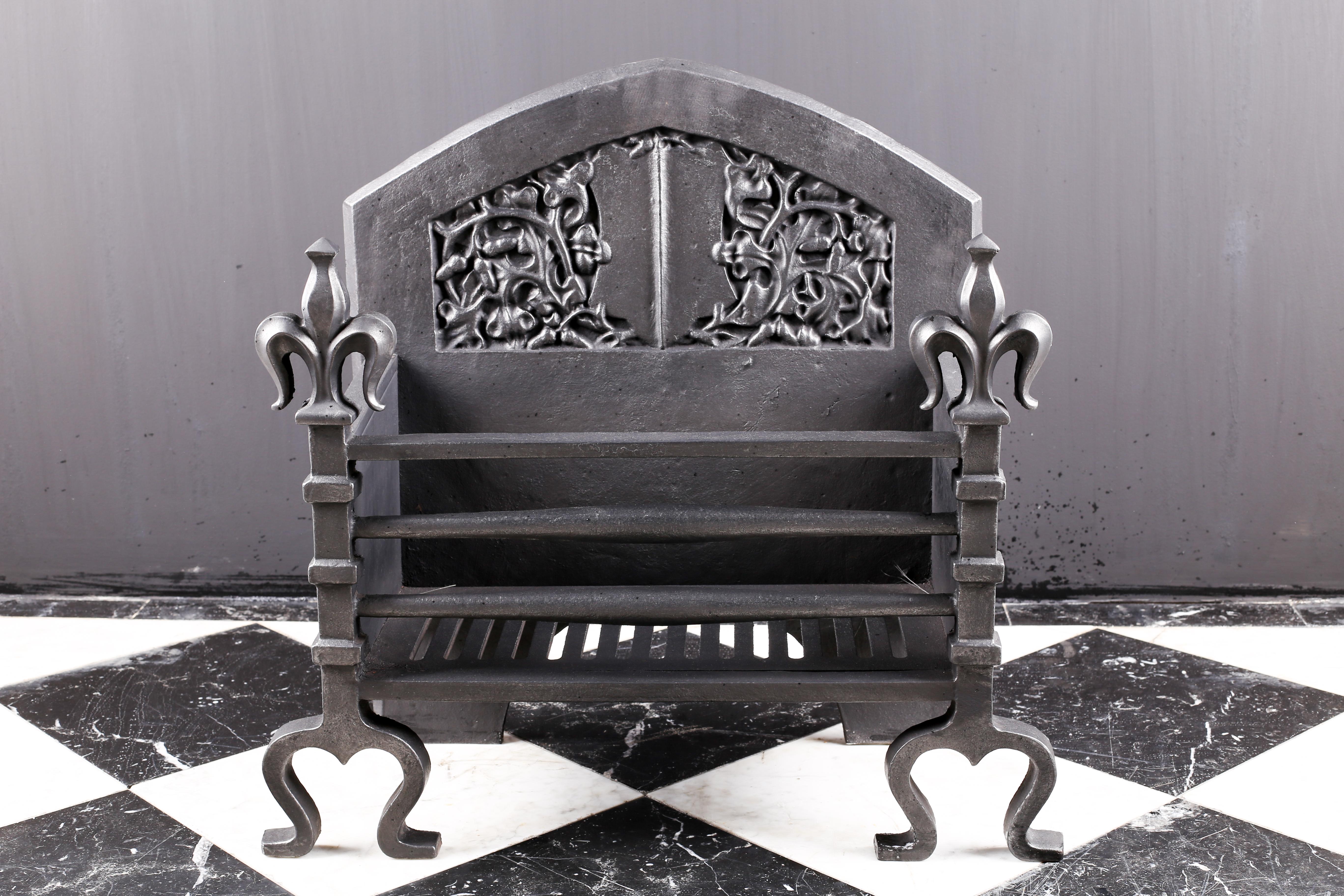 A cast iron Arts & Crafts Victorian fire grate in the Renaissance style, English 20th century.

Measures: Depth 10 1/2