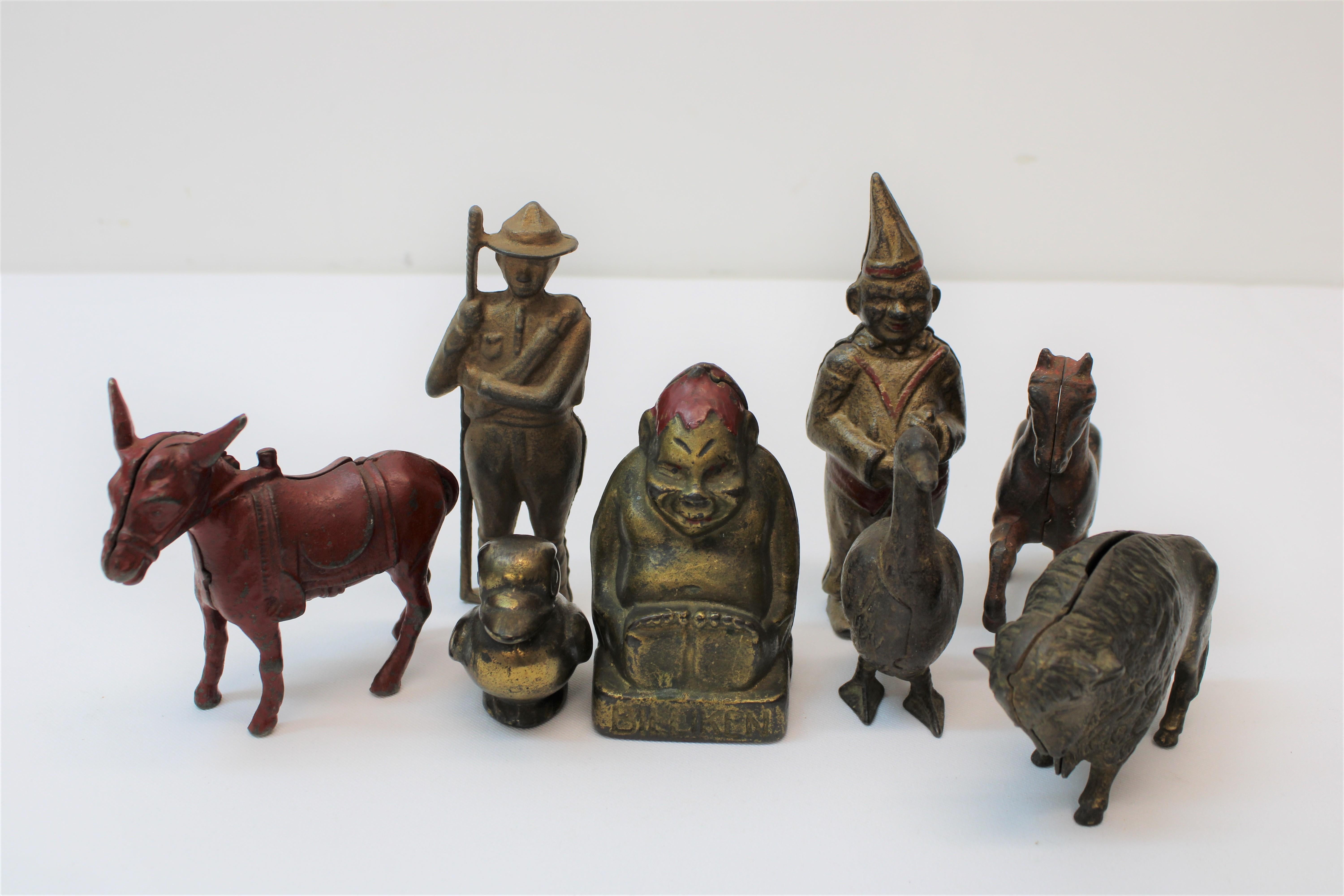 C. 19th century early 20th century adorable cast iron banks ( set of 8 )

Measurements of items individually

Pointy hat bank
Height - 6.25
Width - 2.00

Monkey w/ red hat
Height - 4.00
Width - 2.75

Ranger / scout
Height - 5.50
Width