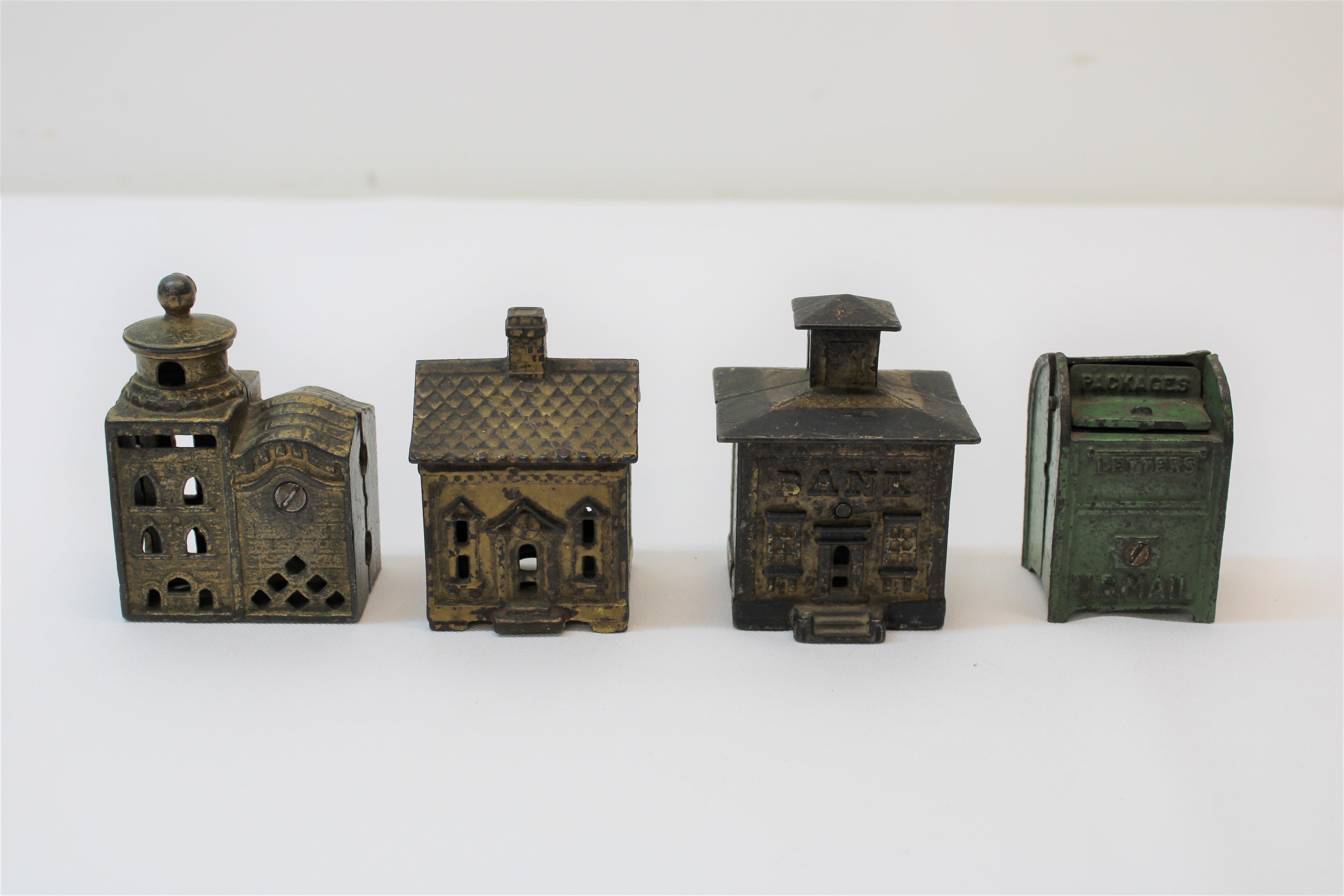 C. 19th century cast iron banks ( set of 4 )

Measurements of items individually 

Iron mailbox
Height - 2.50
Width - 1.75

Iron bank
Height - 3.25
Width - 2.75

Iron palace 
Height - 3.50
Width - 2.50

Iron church
Height -