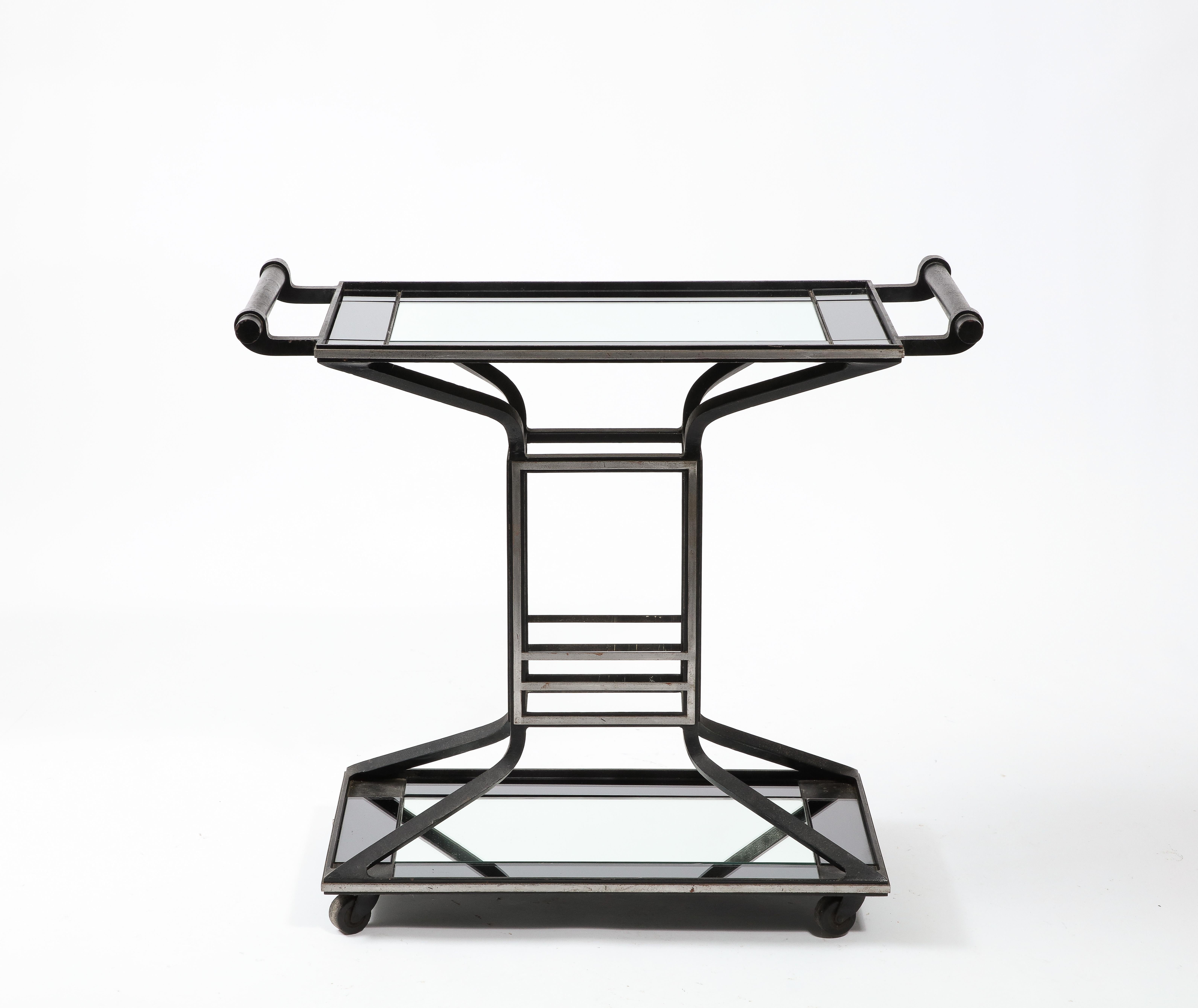 Cast iron bar cart with two tiers, the trays are covered in two-tone mirror.