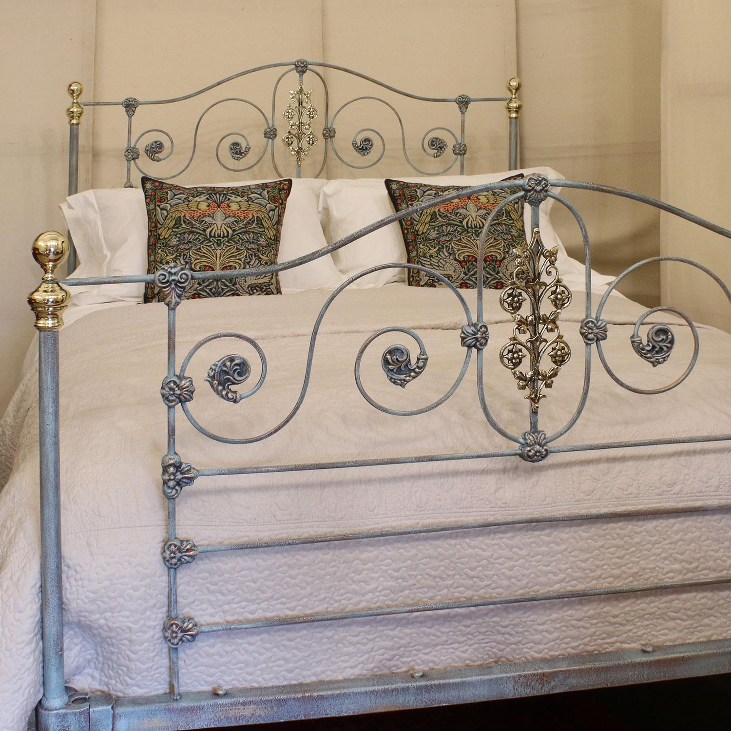 Mid Victorian cast iron bed finished in blue Verdigris with decoratively cast panels.

This bed accepts a British King or American Queen (60in, 5ft or 150cm wide) base and mattress.

The price is for the bed frame alone. The base, mattress,