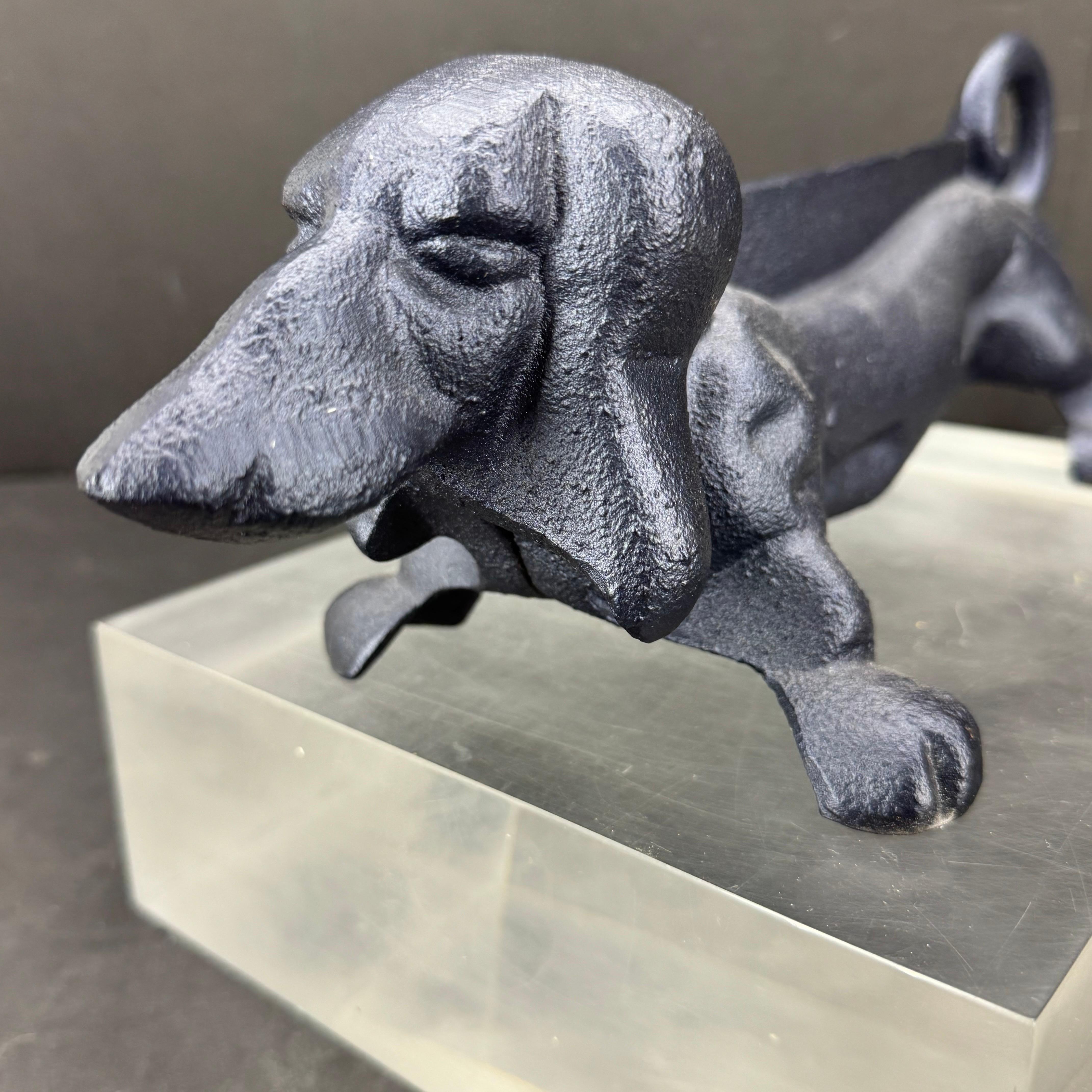 Dachshund cast metal boot scraper or door stop painted in a fantastic shade of blue. We see this one-of-a-kind piece in a foyer, mud room, kitchen area or any room needing a door stopper. Makes a great gift for any animal lover as well. 
