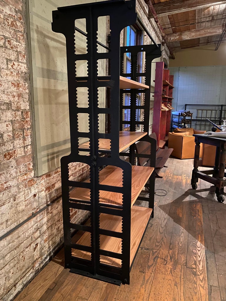 Repurposed cast iron library book case ends with adjustable shelves.
Overall dimensions are 24