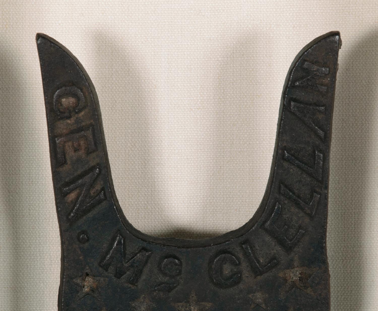 CAST IRON BOOT JACK, MADE FOR THE 1864 PRESIDENTIAL CAMPAIGN OF GENERAL GEORGE B. MC CLELLAN, WITH A FANTASTIC SLOGAN THAT READS 