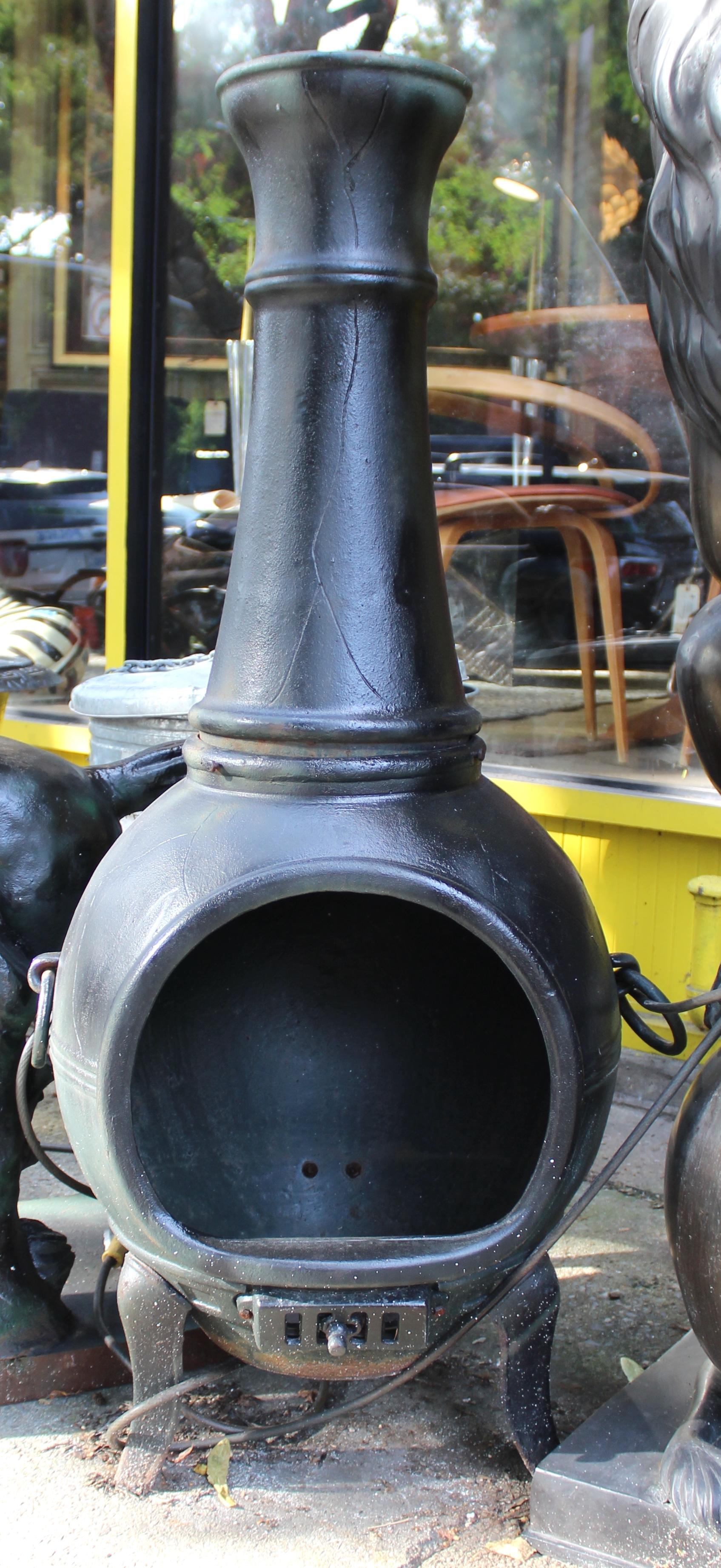 This cast iron chiminea features a wonderful old fashioned design. Two pieces with flared legs.
This piece would make a perfect center piece to any outdoor lounge area. 
Please confirm location with seller (NY or NJ)