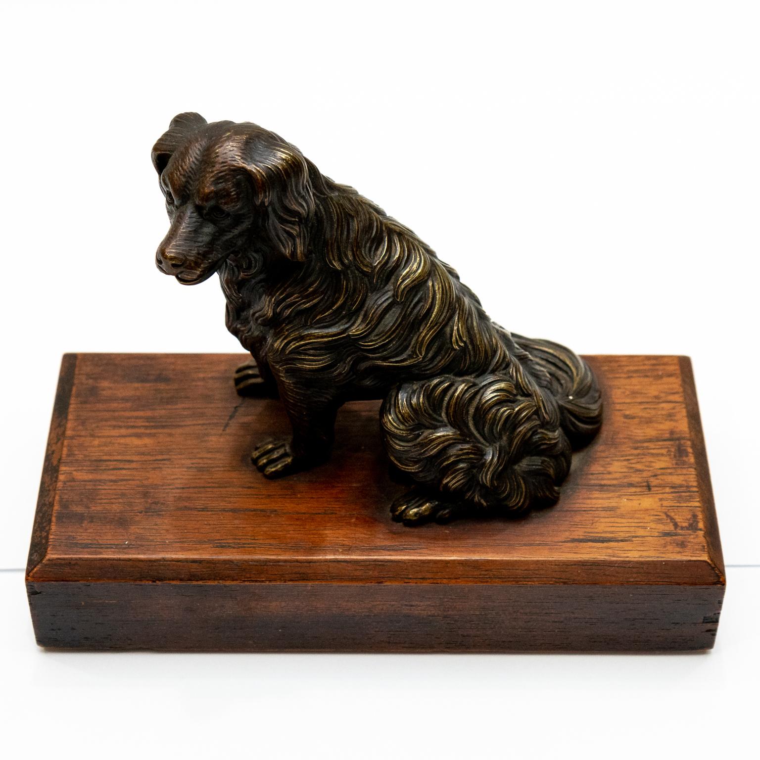 German or Austrian curiosity-antique cast iron dog figurine. The muzzle has a spring jaw hinge mechanism- can hold pen or pock watch. Please note of wear consistent with age.

