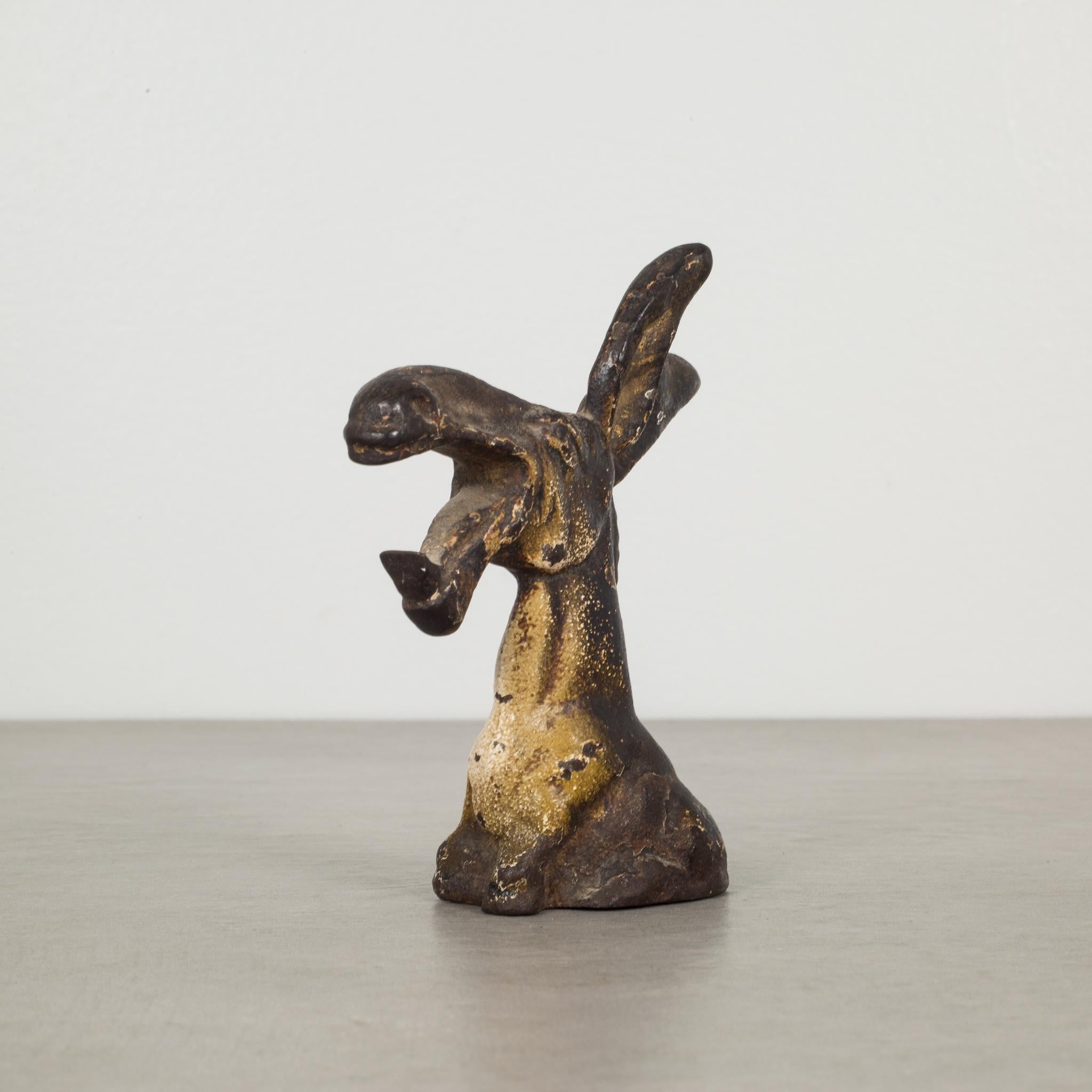 This is an original cast iron donkey bottle opener manufactured by the Hubley manufacturing Company in Lancaster Pennsylvania USA. The piece has retained its original hand painted finish and is in excellent condition with the appropriate patina for