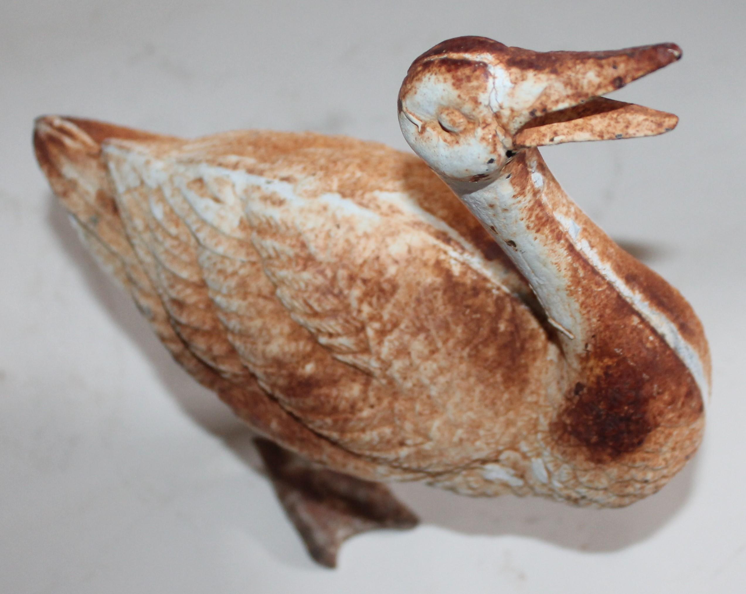 Early 20th century cast iron door stop with all original paint with a beautiful patina.