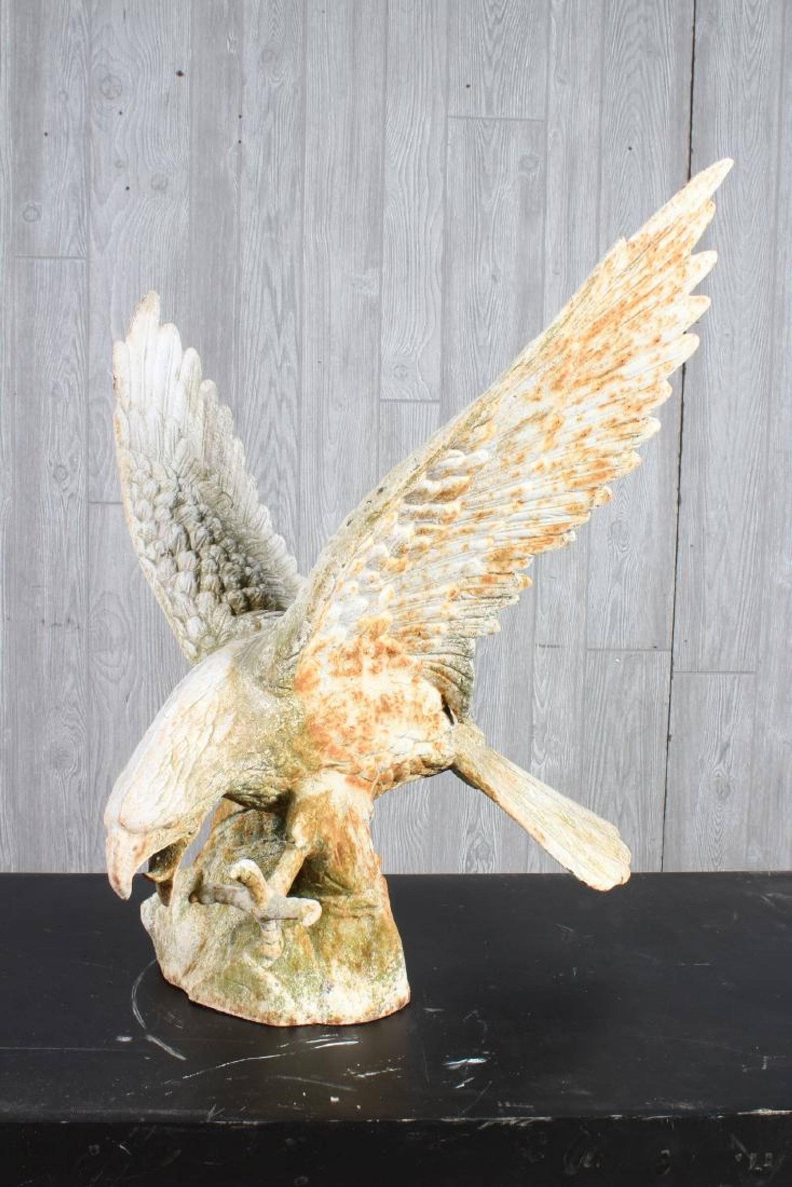 Superb details on this statue of an eagle in landing from flight. Fabulous for an indoor sculptural space as well as garden space.