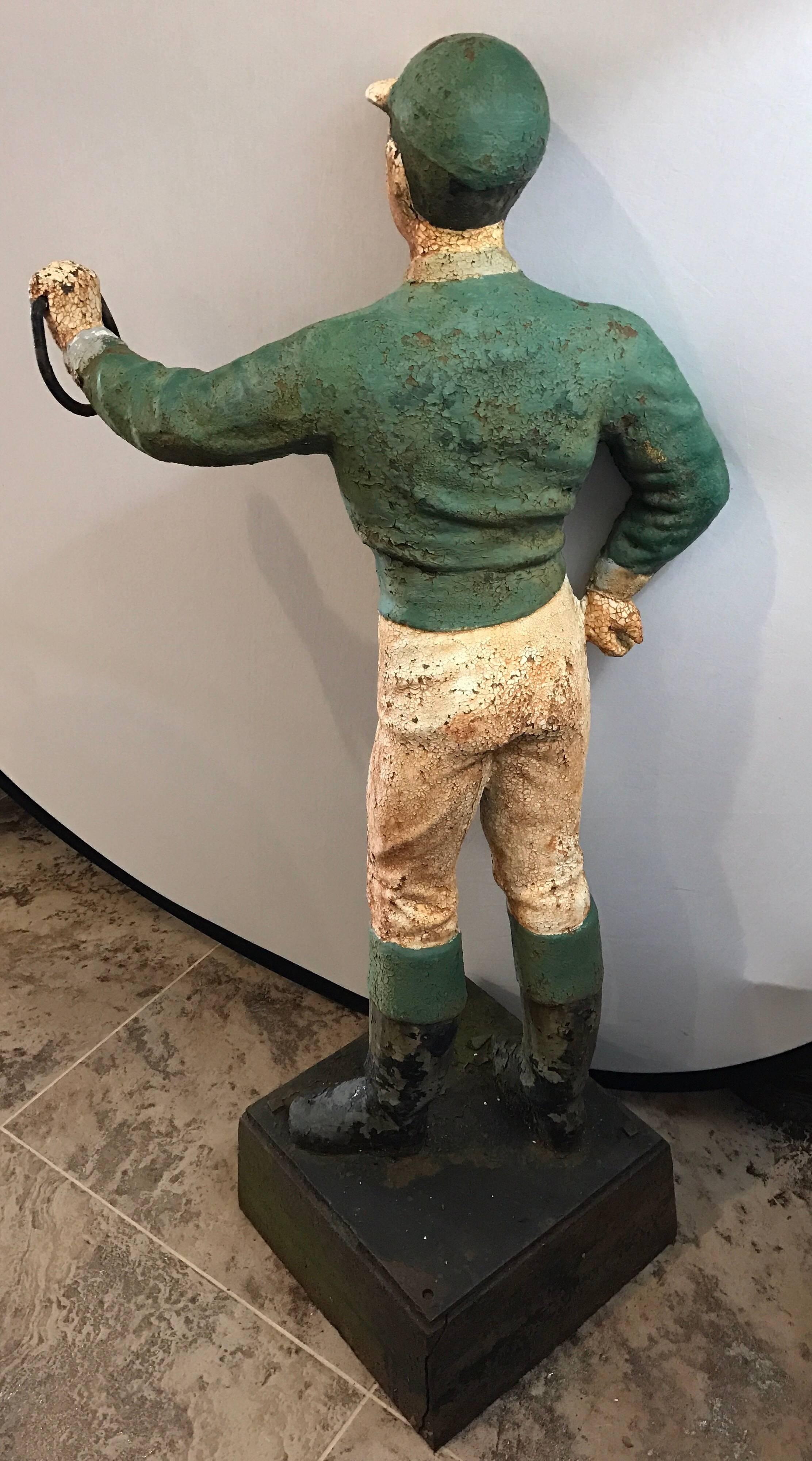 Very heavy 4 foot cast iron painted lawn jockey or hitching post.