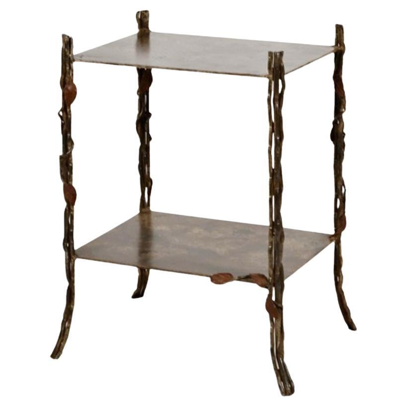This superb example of a unique faux bois end table or stand. The table is in overall very good patinated condition with no losses noted. The bronze casting of the three-twig legs is very naturalistic and is of excellent quality. The addition of the
