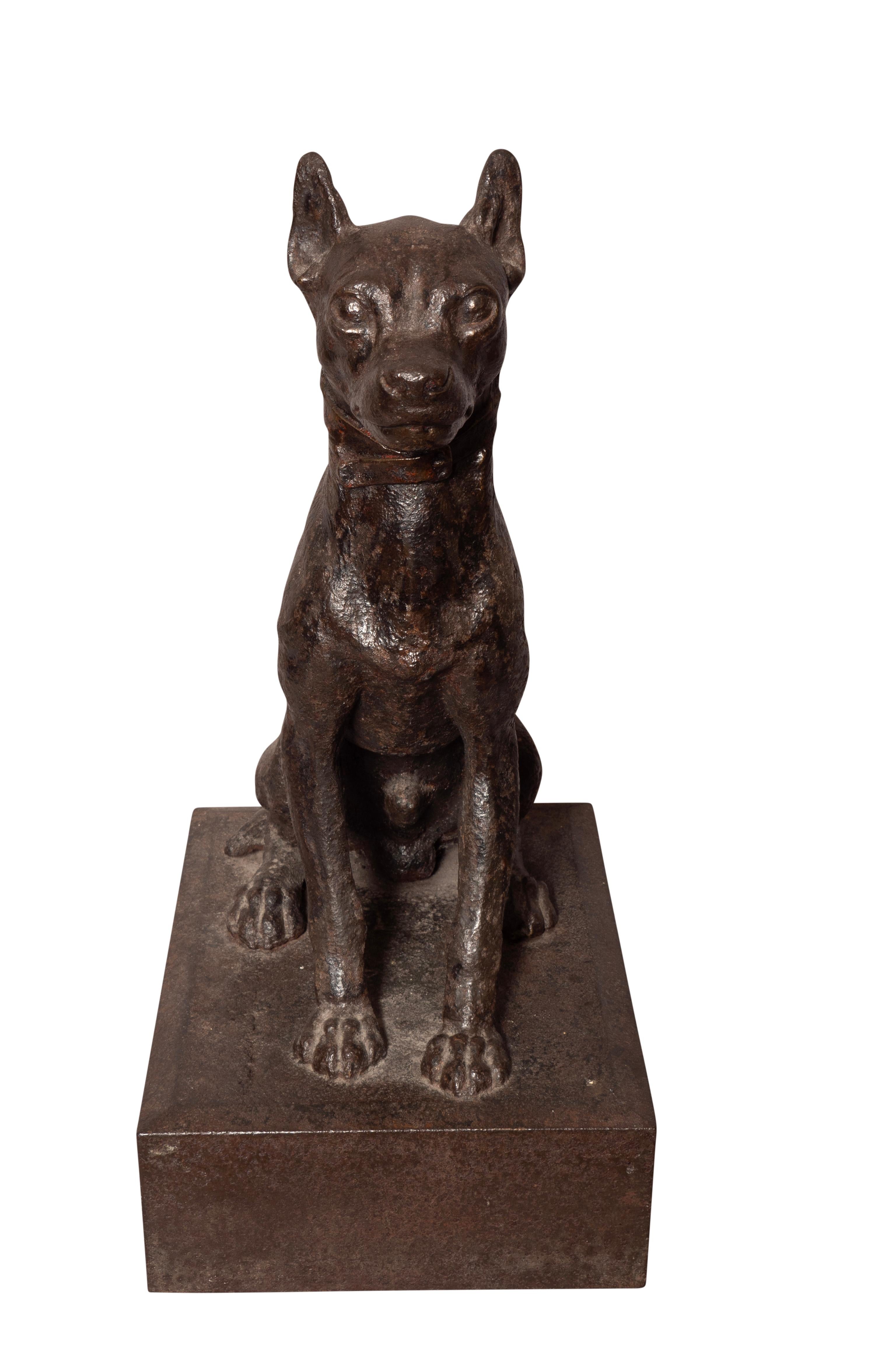 Large heavy seated male dog. Well cast with nice details.Seated on a plinth base.