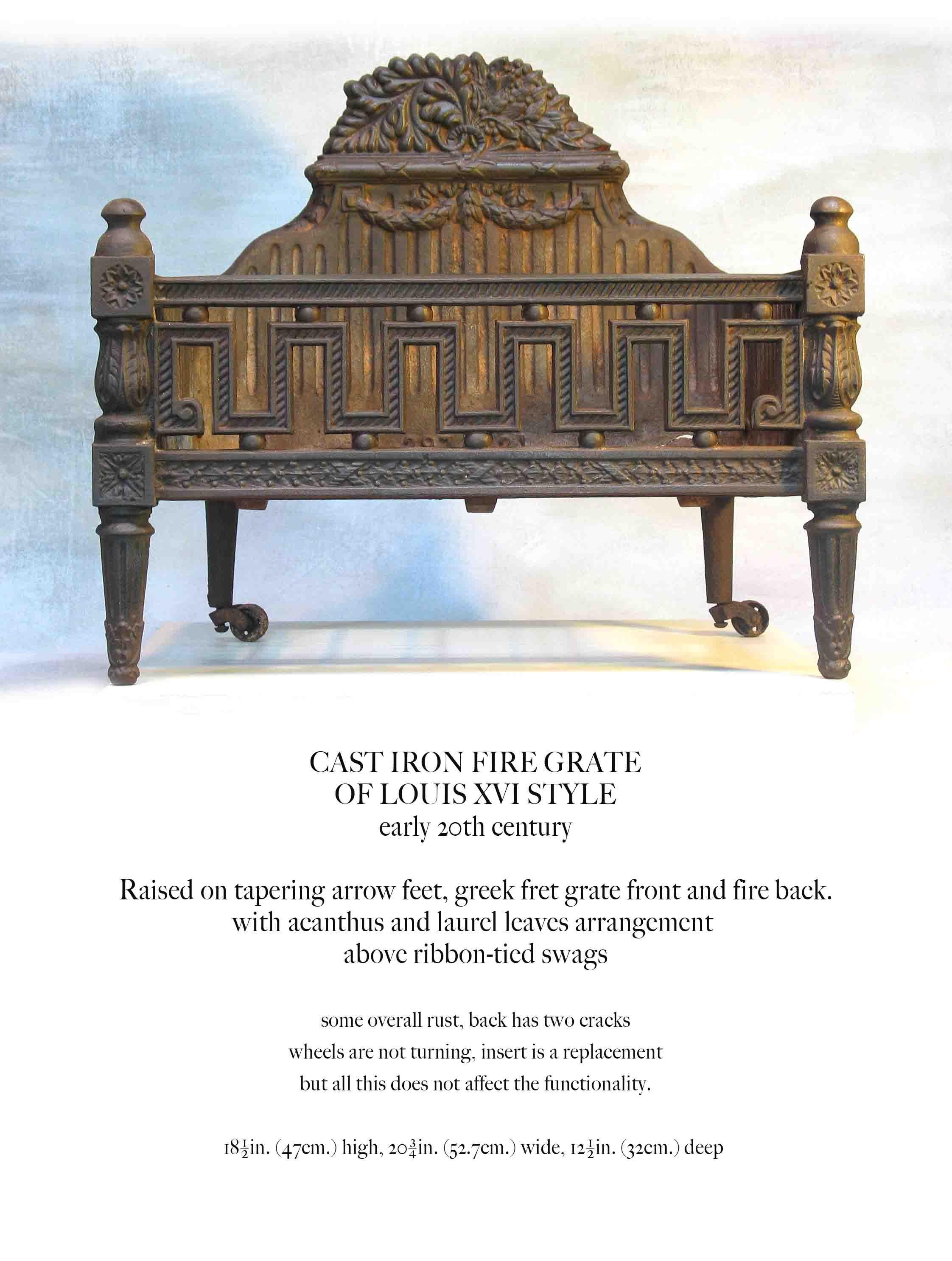 Cast iron fire grate
of Louis XVI style
Early 20th century.

Raised on tapering arrow feet, greek fret grate front and fire back,
with acanthus and laurel leaves arrangement 
above ribbon-tied swags.

Some overall rust, back has two