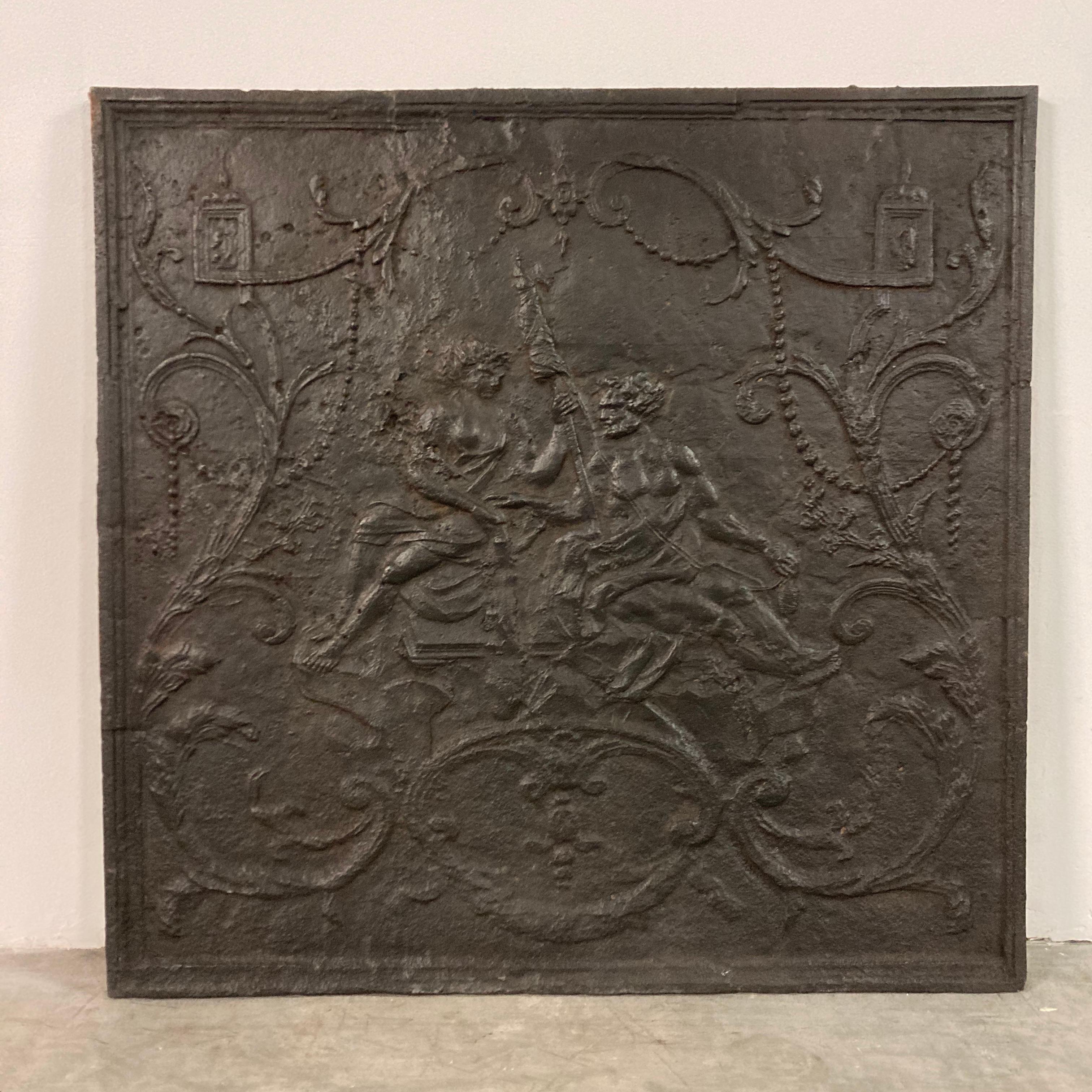 A beautiful cast iron Louis XV fireback or backsplash from the 18th century. Displaying the spell of Omphale, Queen of Lydia.
Hercules is spinning the wool, spindle and distaff in hand at Omphale's feet.

The beautiful original condition, scale