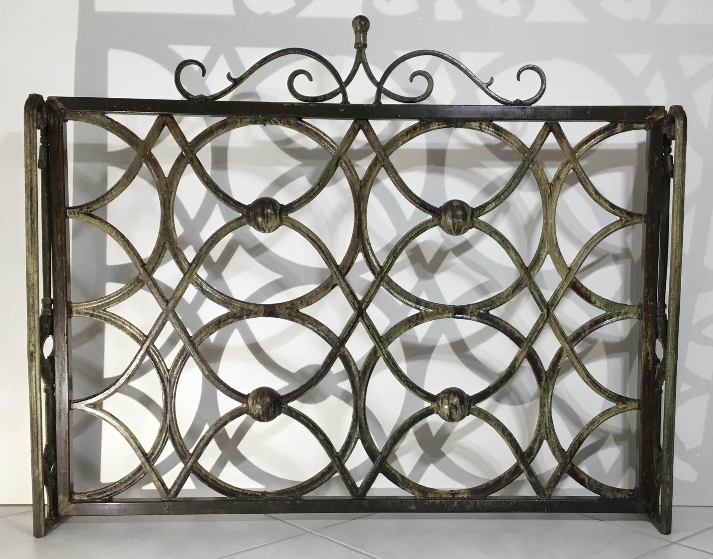 Beautiful fireplace screen made of cast iron with artistic circular motifs all around, treated and sealed for rust, great object of art for display.