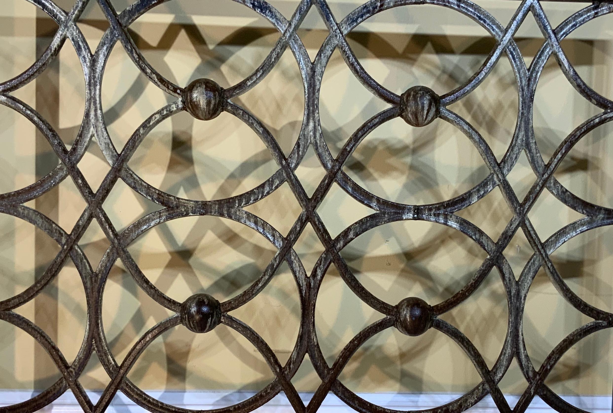 Elegant fireplace screen made of cast iron, artistic circular motif all around with great looking patina. Treated and sealed for rust.
Beautiful object of art for the fireplace.
