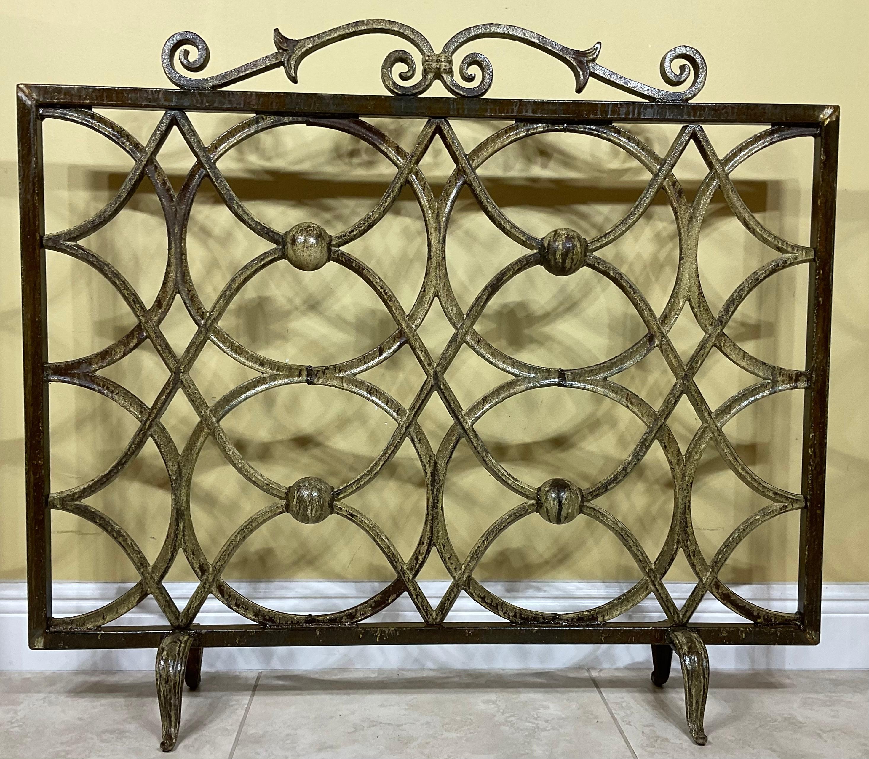 Elegant fireplace screen made of cast iron with artistic circular motifs all around, treated and sealed for rust, great object of art for display.