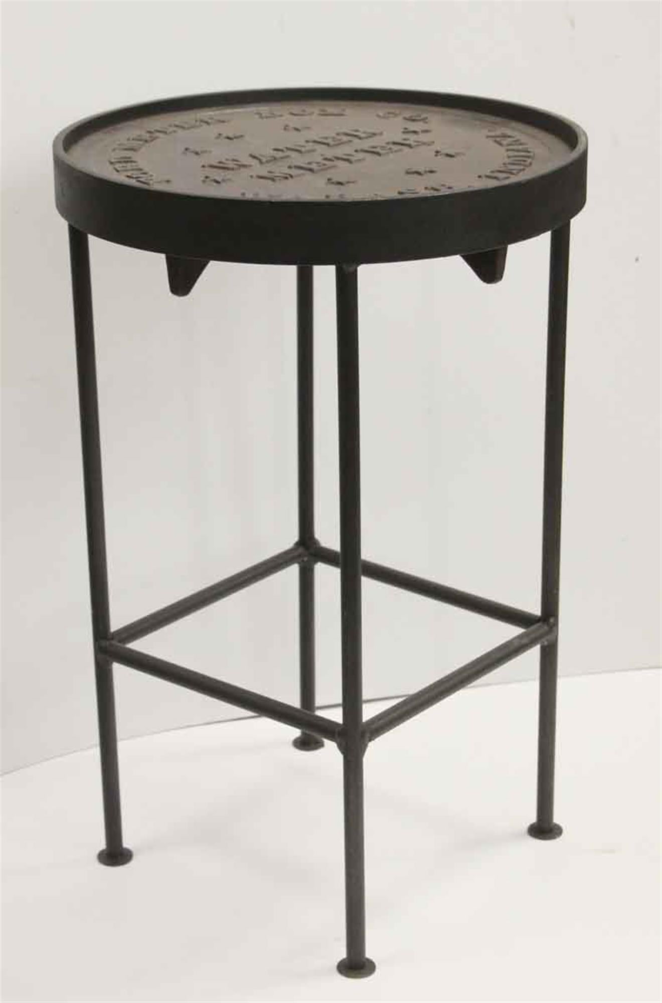 Original cast iron water meter cover converted into a stool. This can also be used as a side table as well. Inscribed 