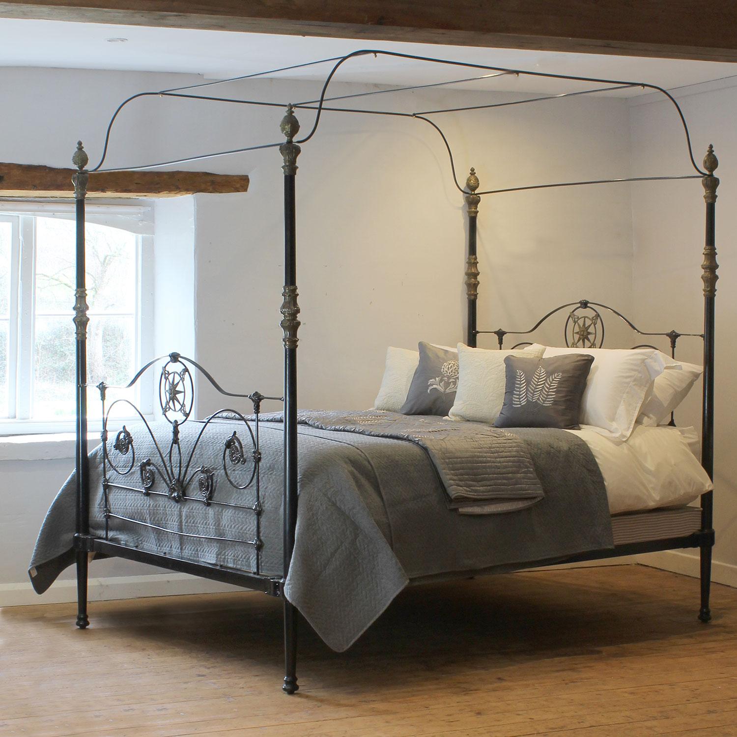 An antique cast iron four poster bed from the late Nineteenth Century, circa 1880. It was manufactured in the UK and shipped to North Africa originally.
The ornate panels at the head and foot of the bed have castings with faded gold lining