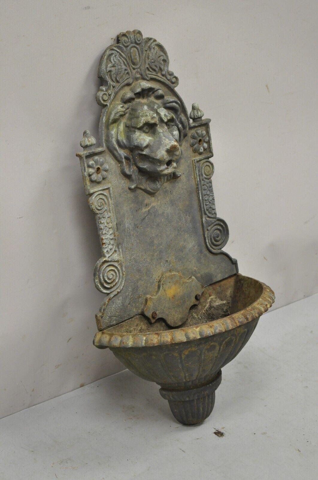 Cast iron French Empire style lion head outdoor garden wall water fountain (black). Item features *currently 2 available. Patina and finish will vary. Price is per piece*. Heavy cast iron construction, desirable weathered patina, approx 40 lbs each.