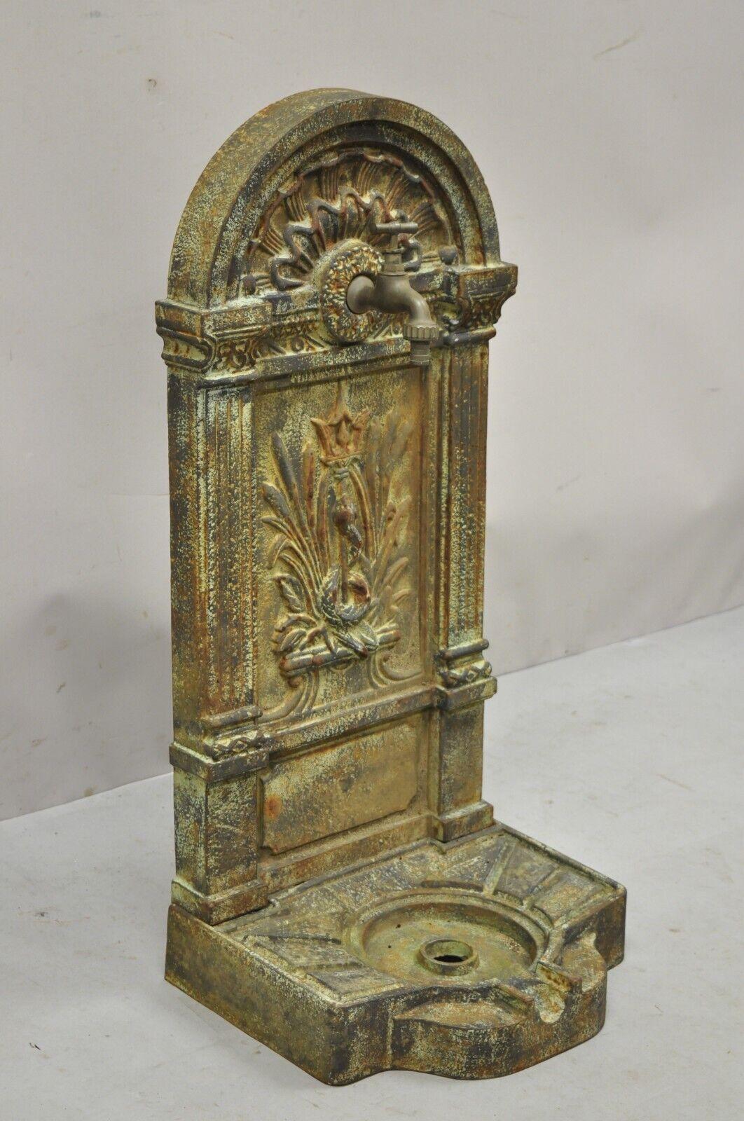 Cast iron French neoclassical style serpent and trident outdoor garden wall fountain. Item features *currently 3 available. Patina and finish will vary. Price is per piece*. heavy cast iron construction, serpent and trident design, desirable