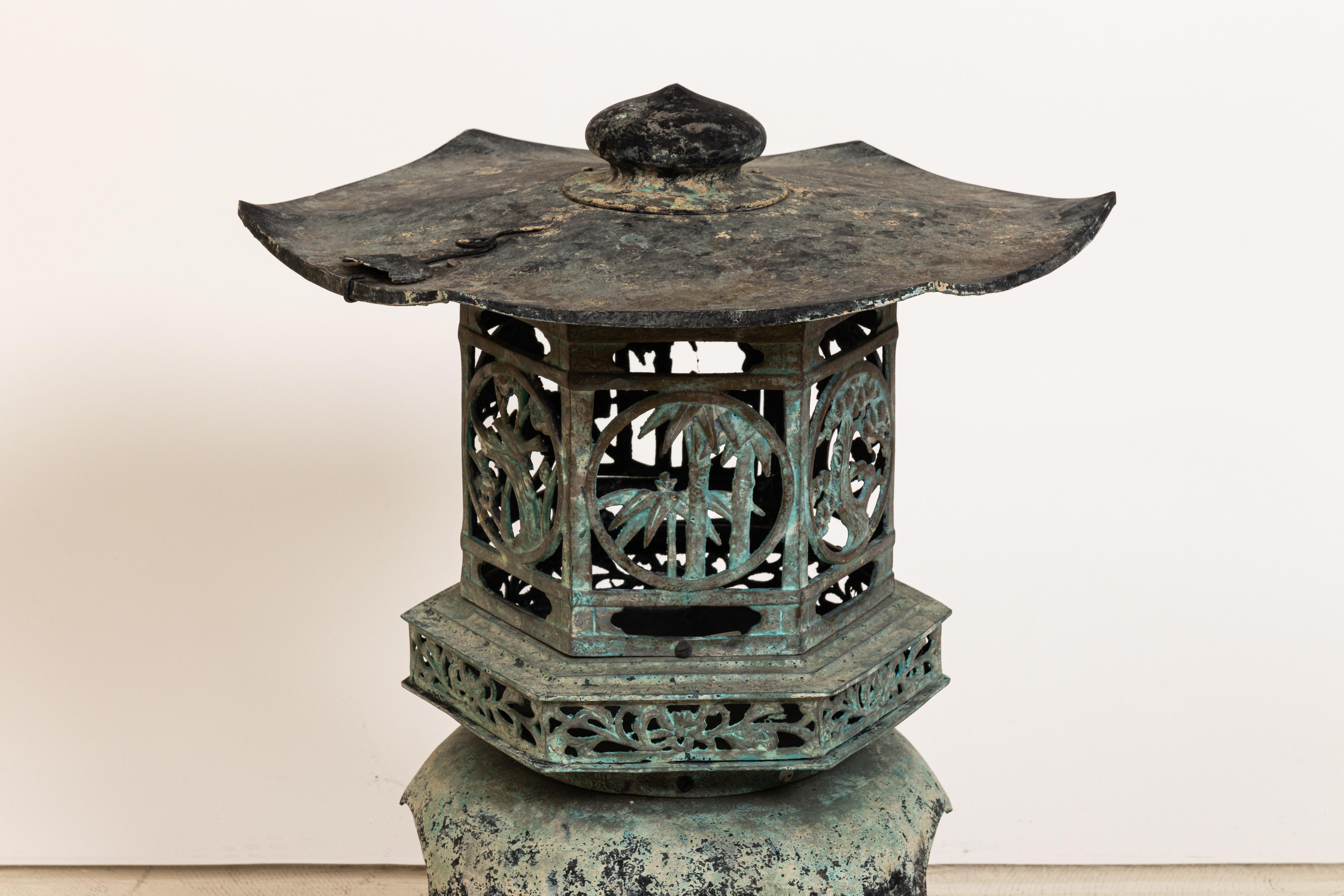 Japanese Cast iron garden pagoda candle holder with great patina finish, circa 1960s. Opens to put candle inside. Please note of wear consistent with age including minor oxidation, patina, and finish loss throughout.