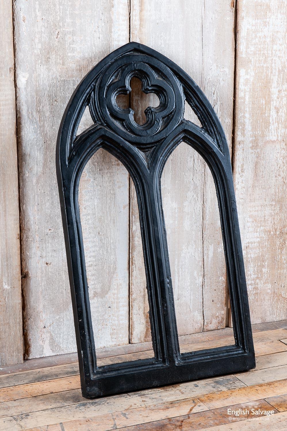 Striking black cast iron Gothic style double arch window frame with quatrefoil detail to the top.
