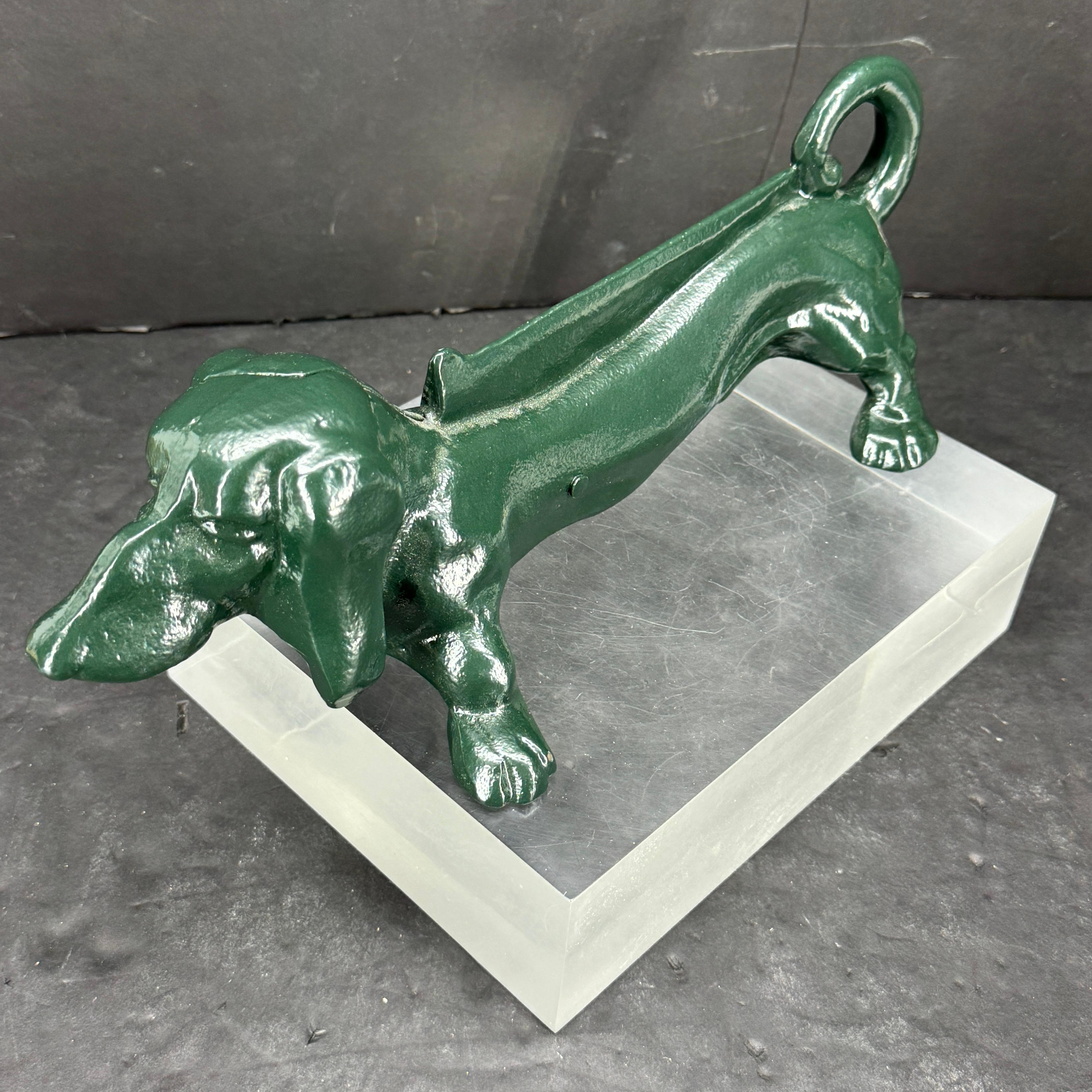 Dachshund cast metal boot scraper or door stop from the 1920's powder-coated in a fantastic shade of green. Add a classic British touch with this one-of-a-kind piece in your foyer, mud room or kitchen area. Makes a great gift for any animal lover as