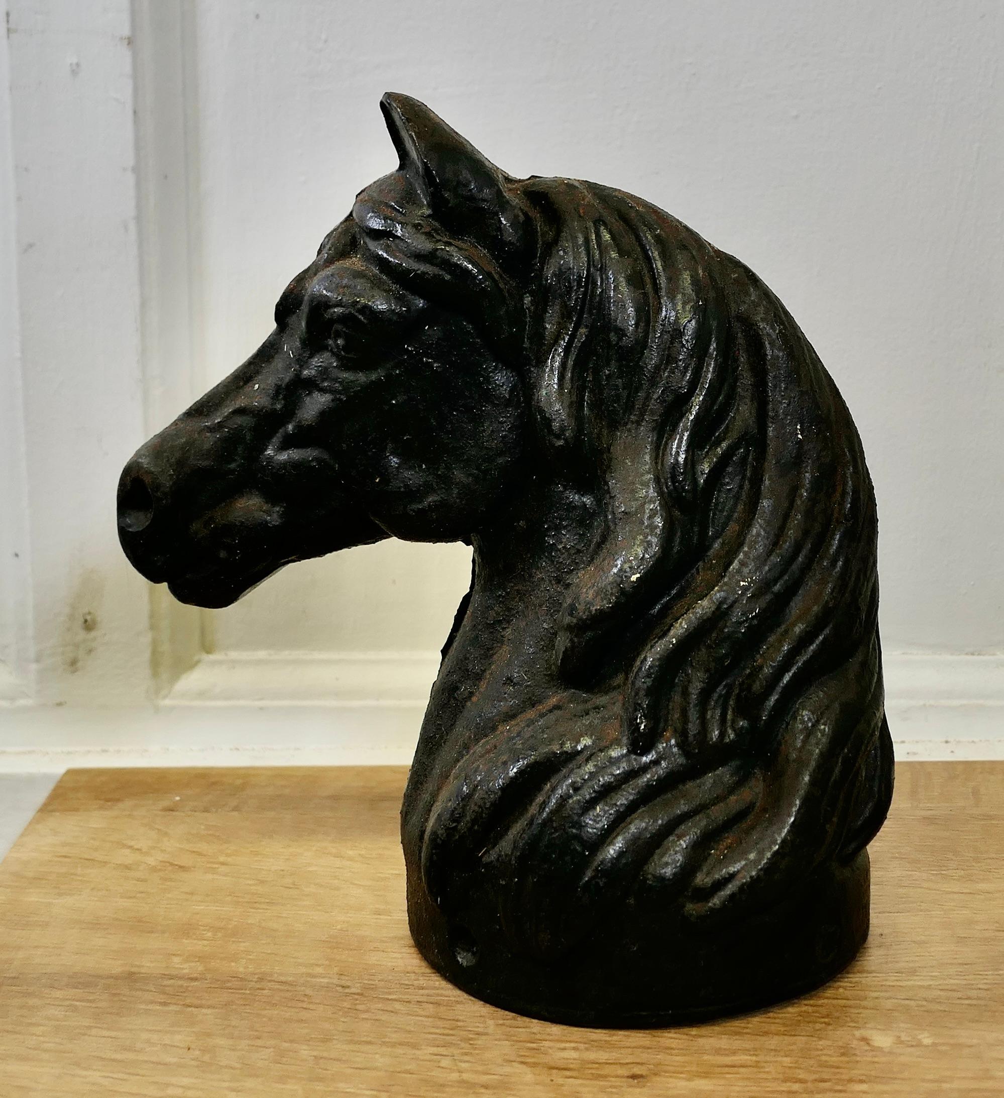 Cast Iron Half Horse Head, Door Stop

This lovely piece has been cast in one piece, the interior is hollow but it is still a very heavy and stable piece and would make a very attractive Door Porter 
The head is in very good condition with a slightly