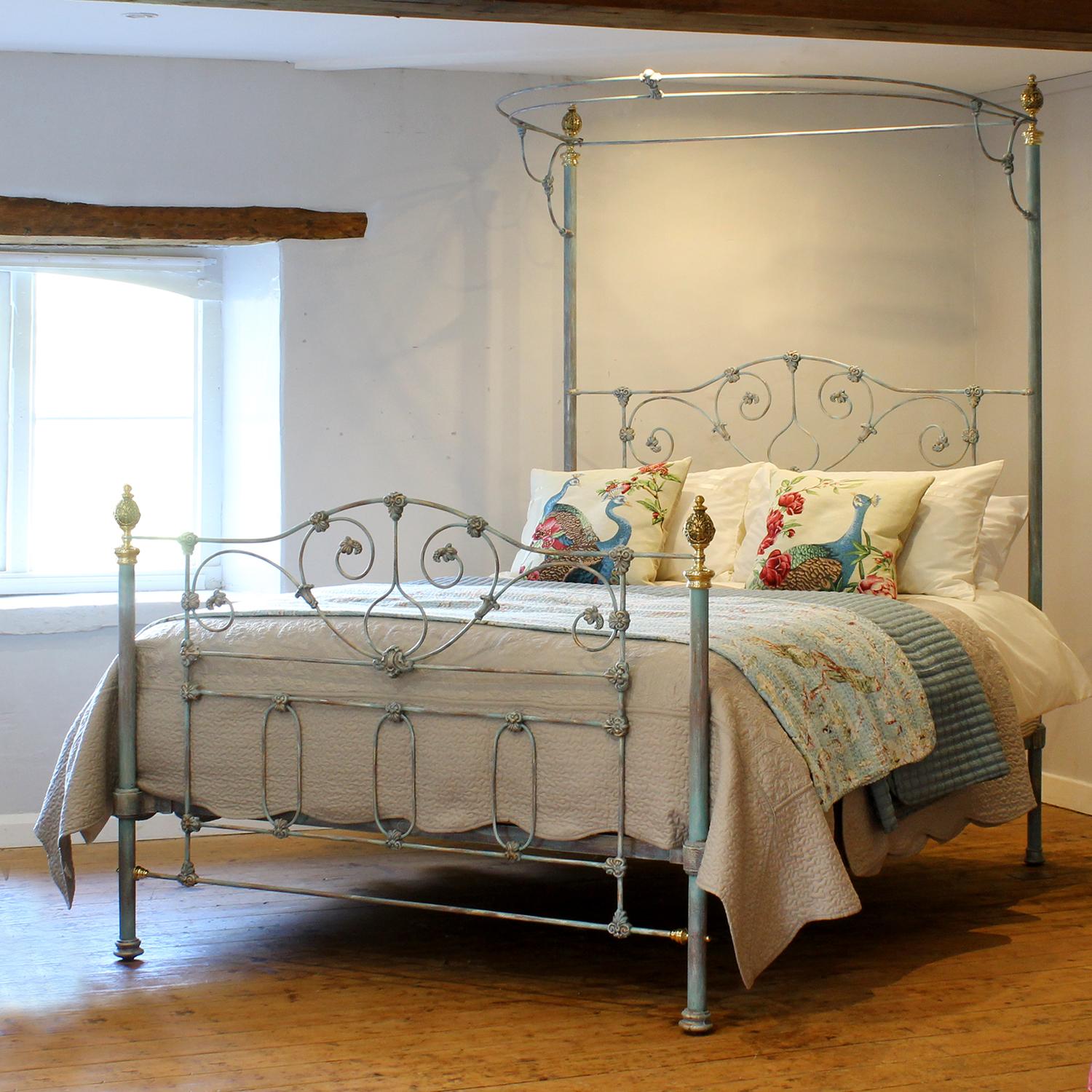 A 5ft wide cast iron antique half tester bed with half-round canopy supported by tall back posts. The attractive castings have been accentuated by the Blue Verdigris finish. 

This bed accepts a British King Size or US Queen Size (5ft or 150cm wide)