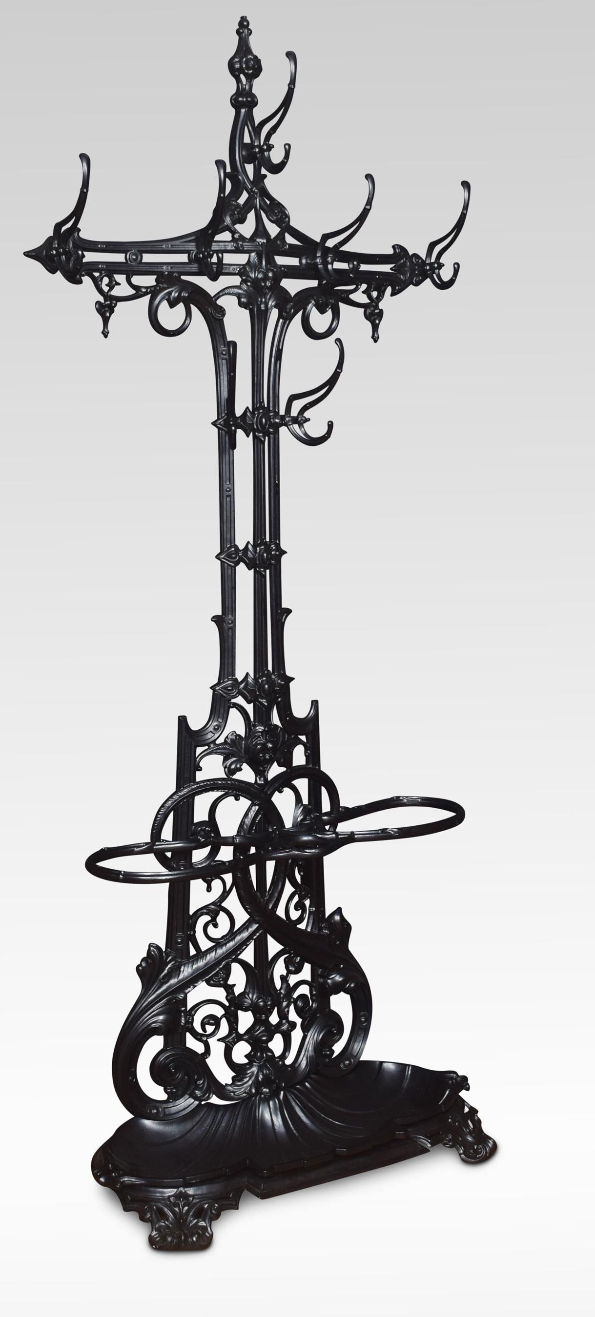 19th century Coalbrookdale cast iron hallstand with a pierced naturalized frame with an arrangement of coat hooks over a figure of eight double umbrella stand above drip tray raised up on scroll front feet
Dimensions:
Height 79 inches
Width 33