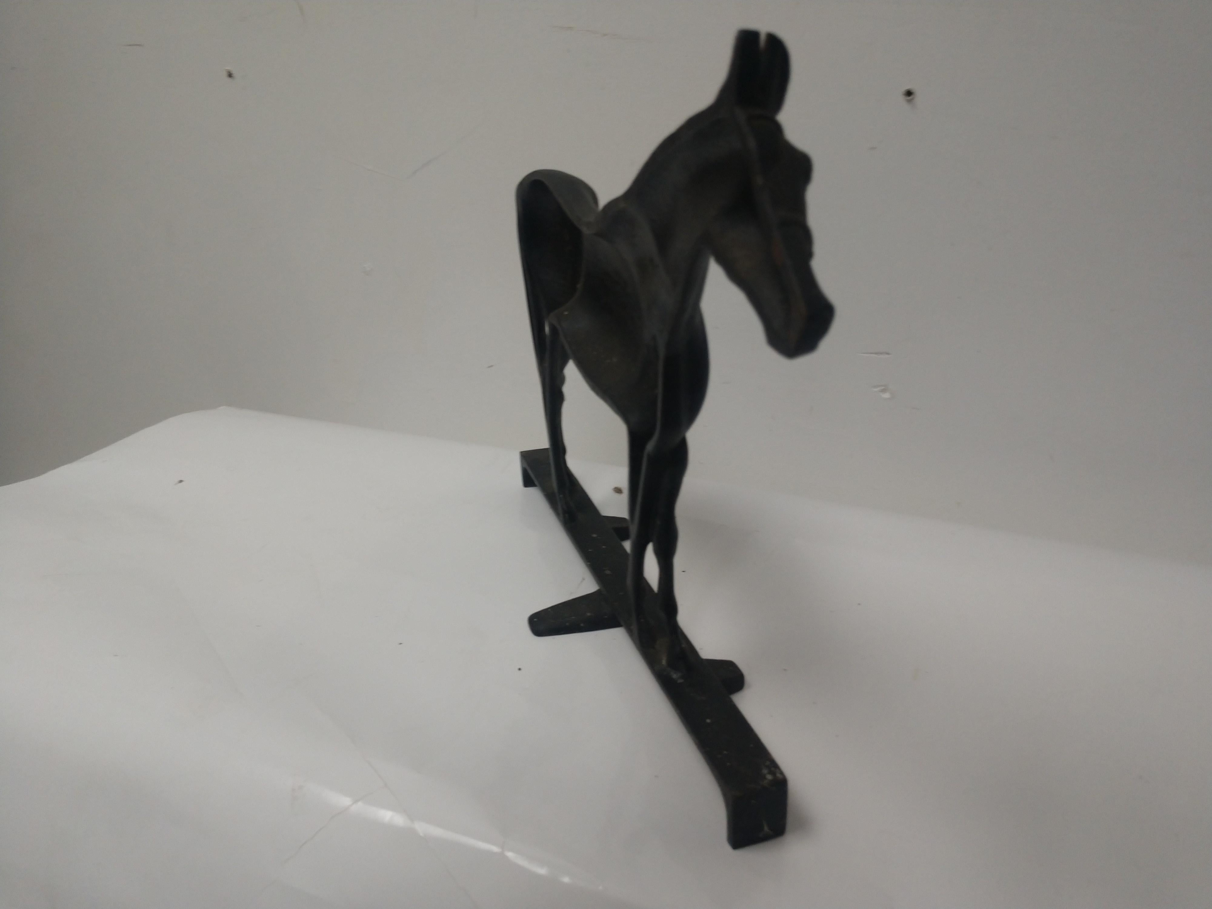 Beautiful depiction of the horse, Hunter, a black stallion. Signed VA.Metalcrafters, 1949.
