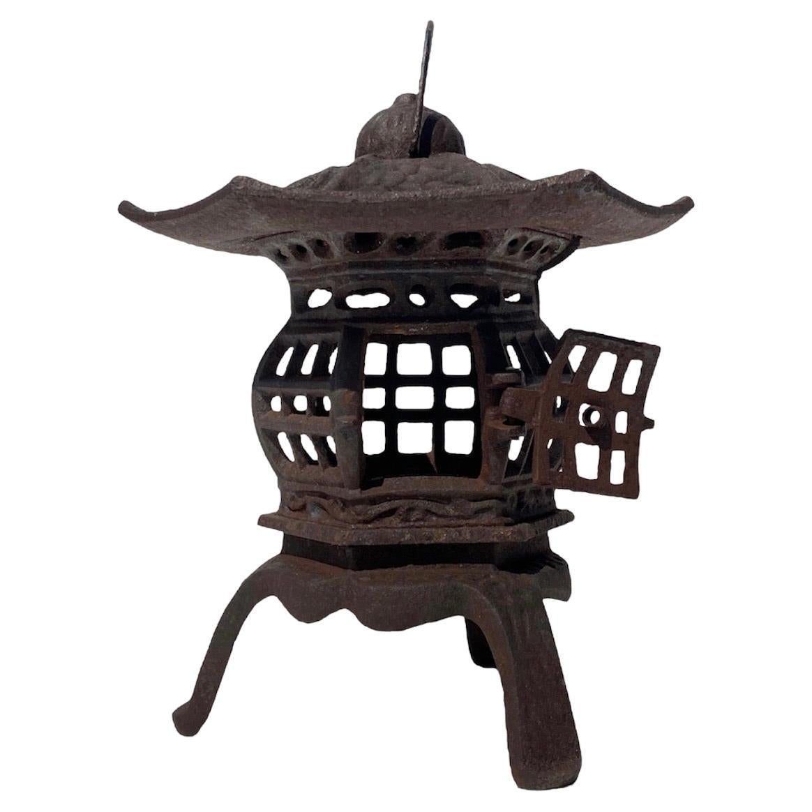 Cast iron garden pagoda lantern from Japan, aged beautifully and will work well both inside or in the garden setting. 
Very special.