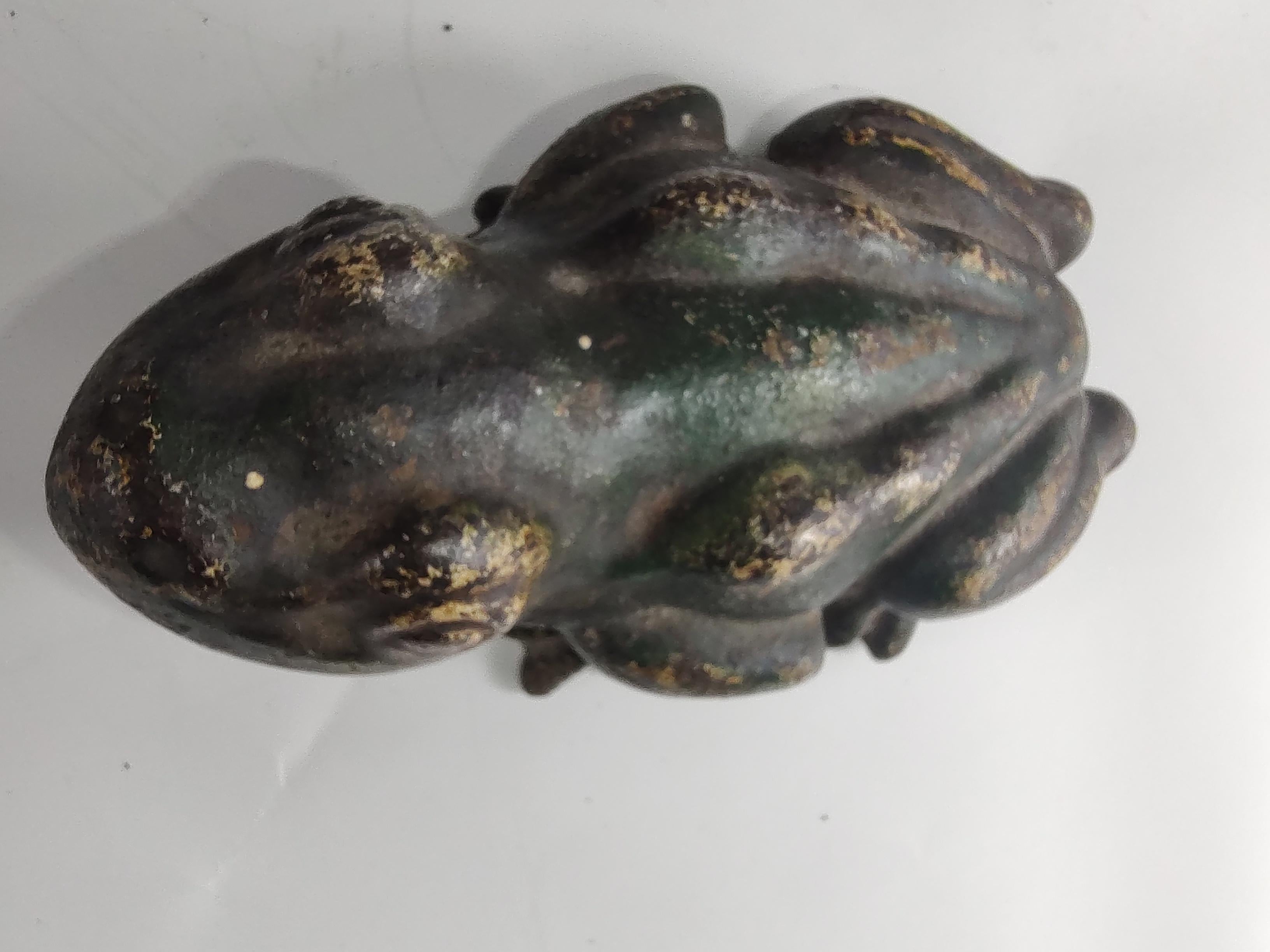 Fabulous cast iron door stop in the form of a frog. Original Paint is mostly intact.