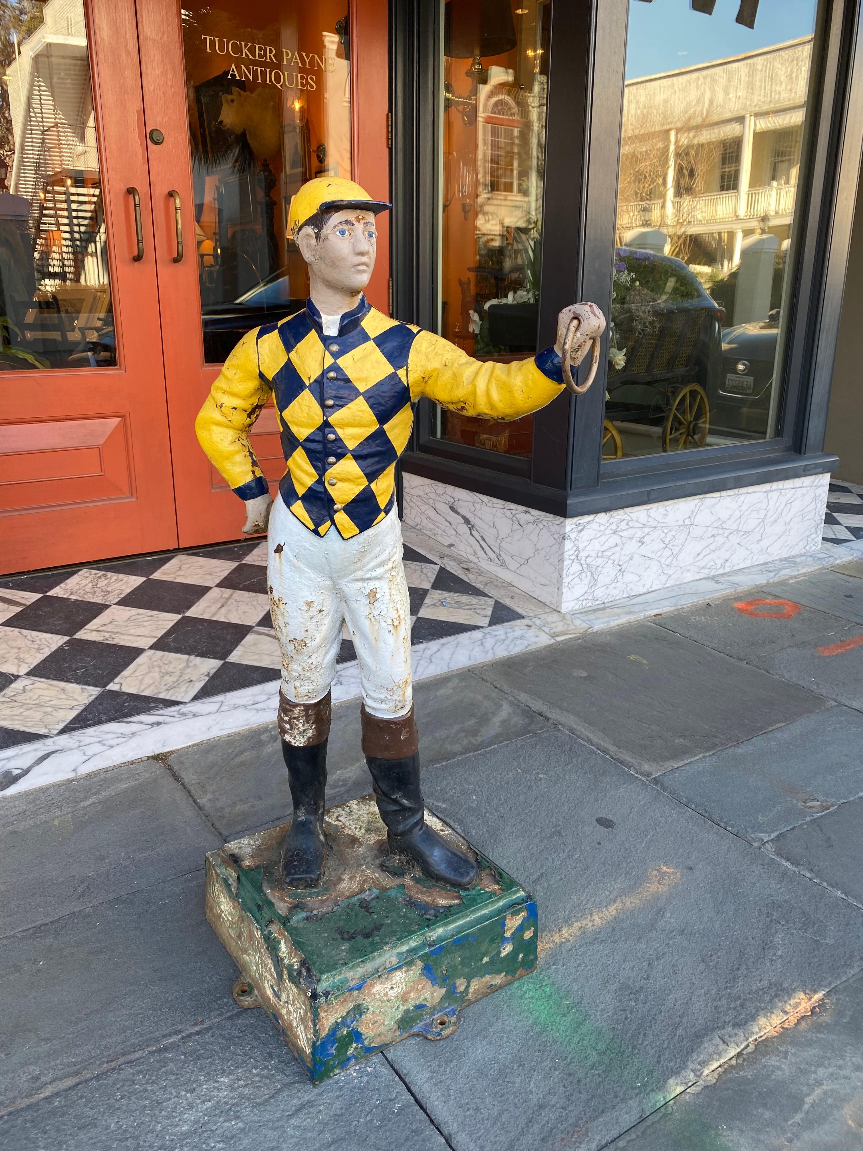 Cast iron lawn jockey from the 1900s, in great pain.
