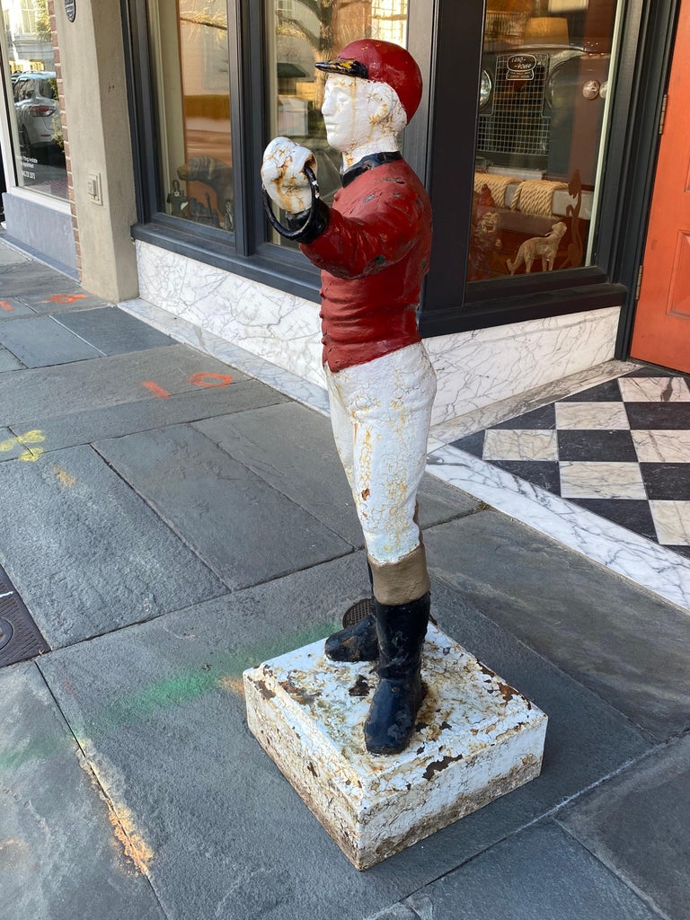 Cast Iron Lawn Jockey from the 1920s, in Red and White Paint at 1stDibs