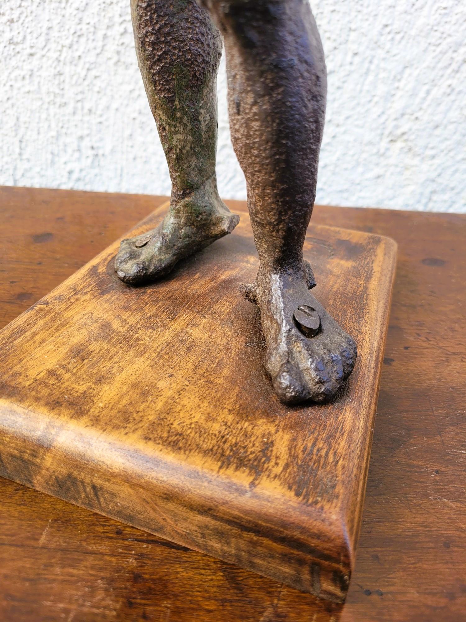Representation of Mercury in cast iron on a wooden base: Mercury (Roman God) or Hermes (Greek God), the messenger god of the other gods is recognizable here thanks to the caduceus he holds in his hand and his winged sandals

Cast iron sculpture