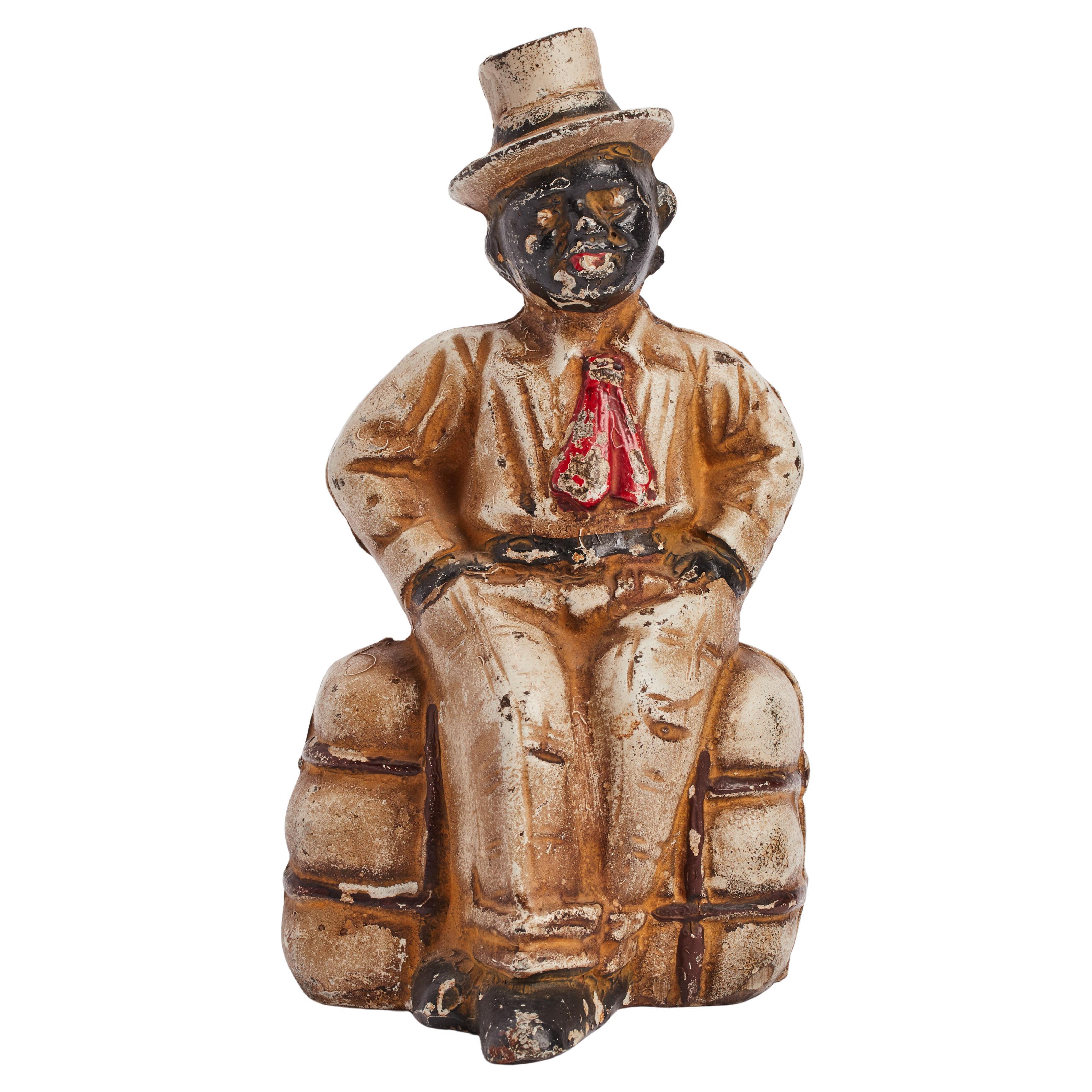 Cast iron money bank depicting an Afro-American, USA 1920.