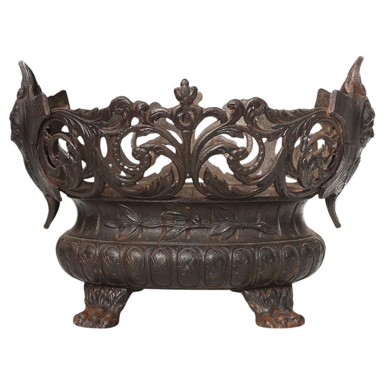 Cast Iron planter decorated with masks and lion paws, France 1850s