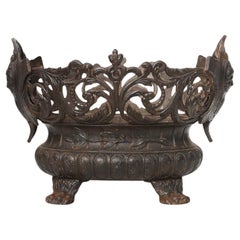 Cast Iron planter decorated with masks and lion paws, France 1850s
