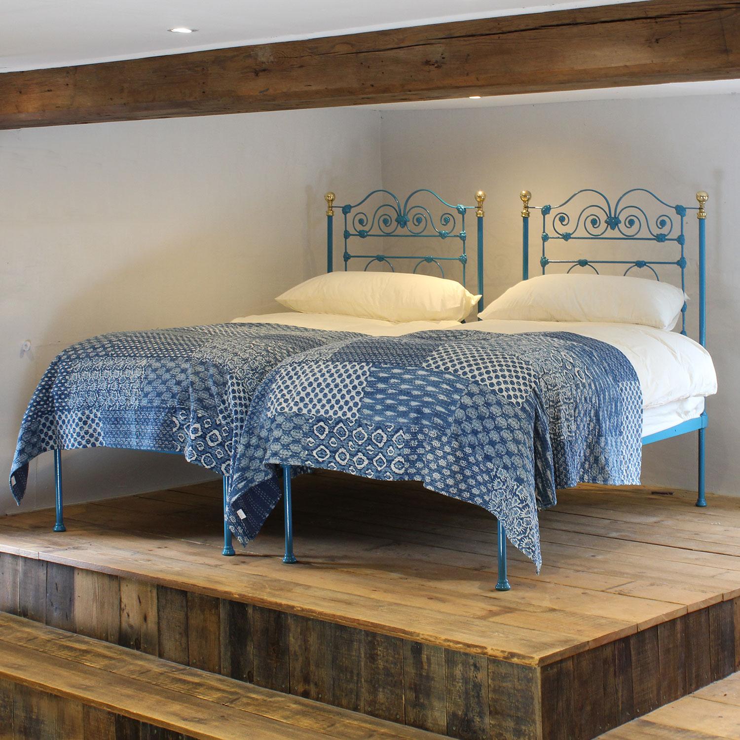 A matching pair of single low end/platform bedsteads, finished in Moroccan blue.

The price includes a pair of single firm platform bases.

The mattresses, bedding and bed linen are extra.