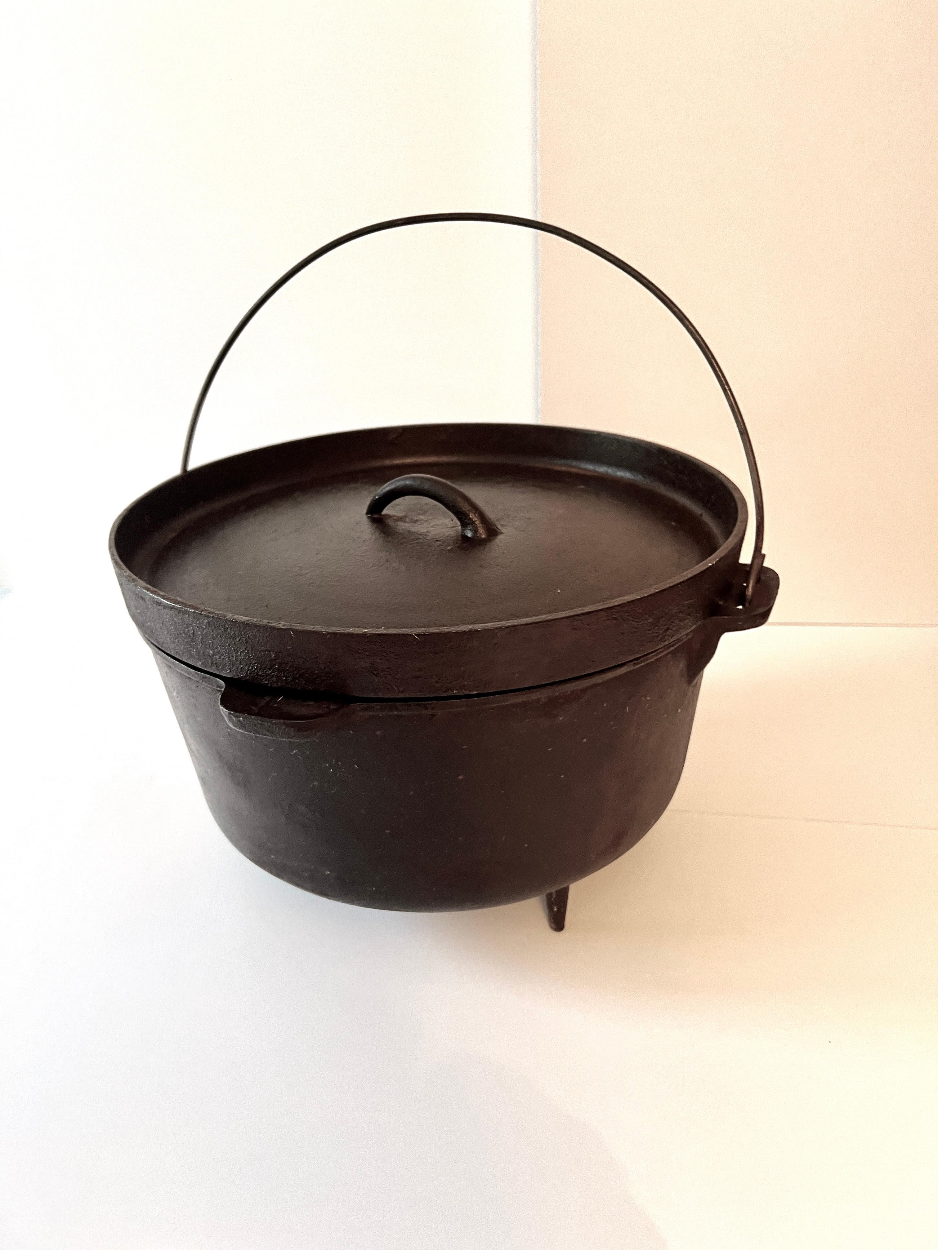 A heavy, 20 Pound, cast iron Cauldron with fitted lid, on three feet with a handle.  

The piece is great for a fireplace decorative item, and is the iconic Halloween Cauldron.   A compliment to many spaces, including a cabin, Rustic appeal