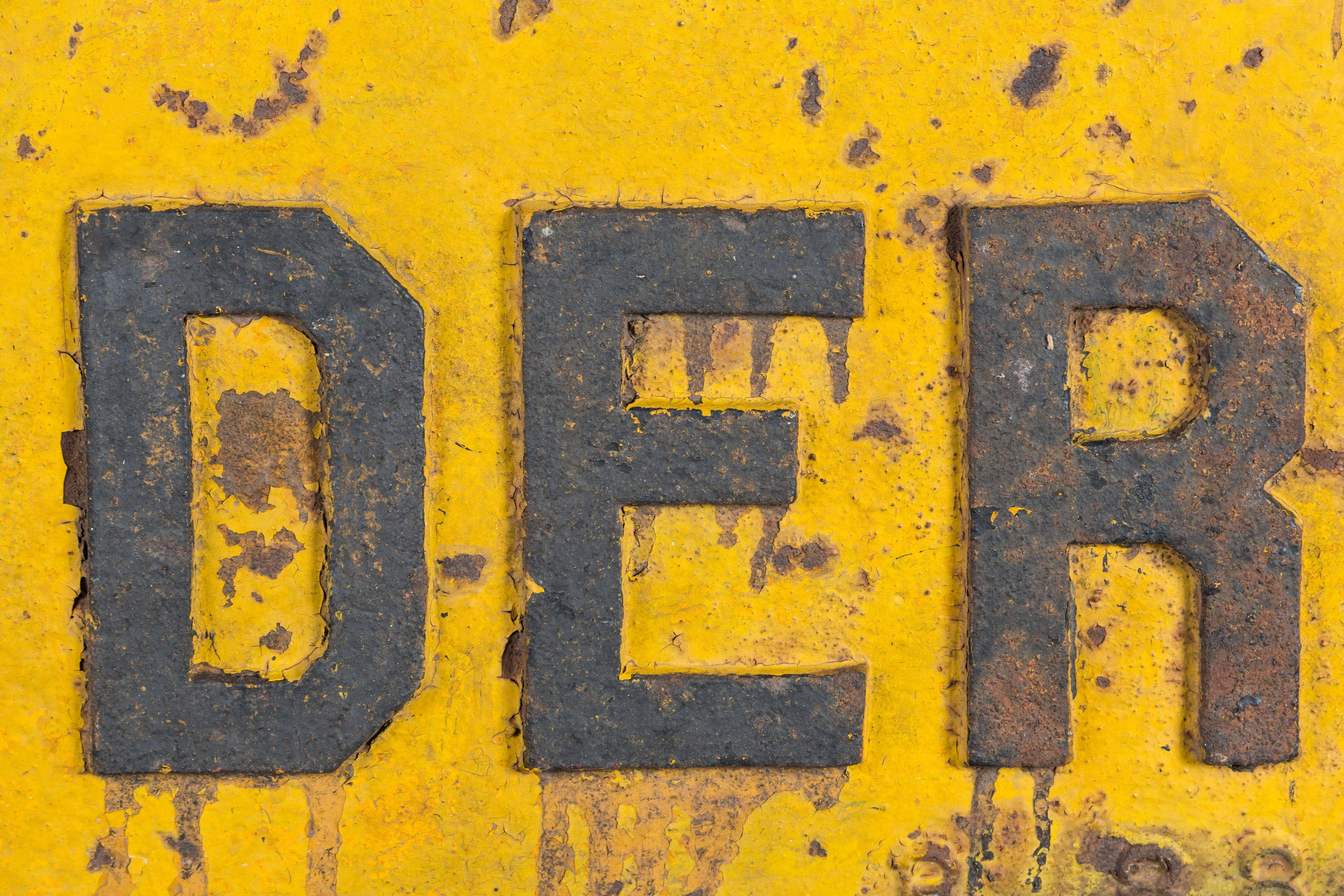 Very thick cast iron DERAIL sign, early 20th century American railroad. Great original yellow and black paint. Two holes for easy mounting. This sign is quite heavy.