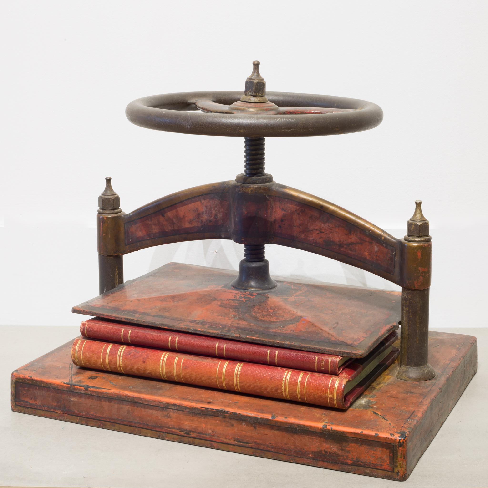 Cast Iron Red Polychromed and Stenciled Wheel Book Press, circa 1930 In Good Condition In San Francisco, CA