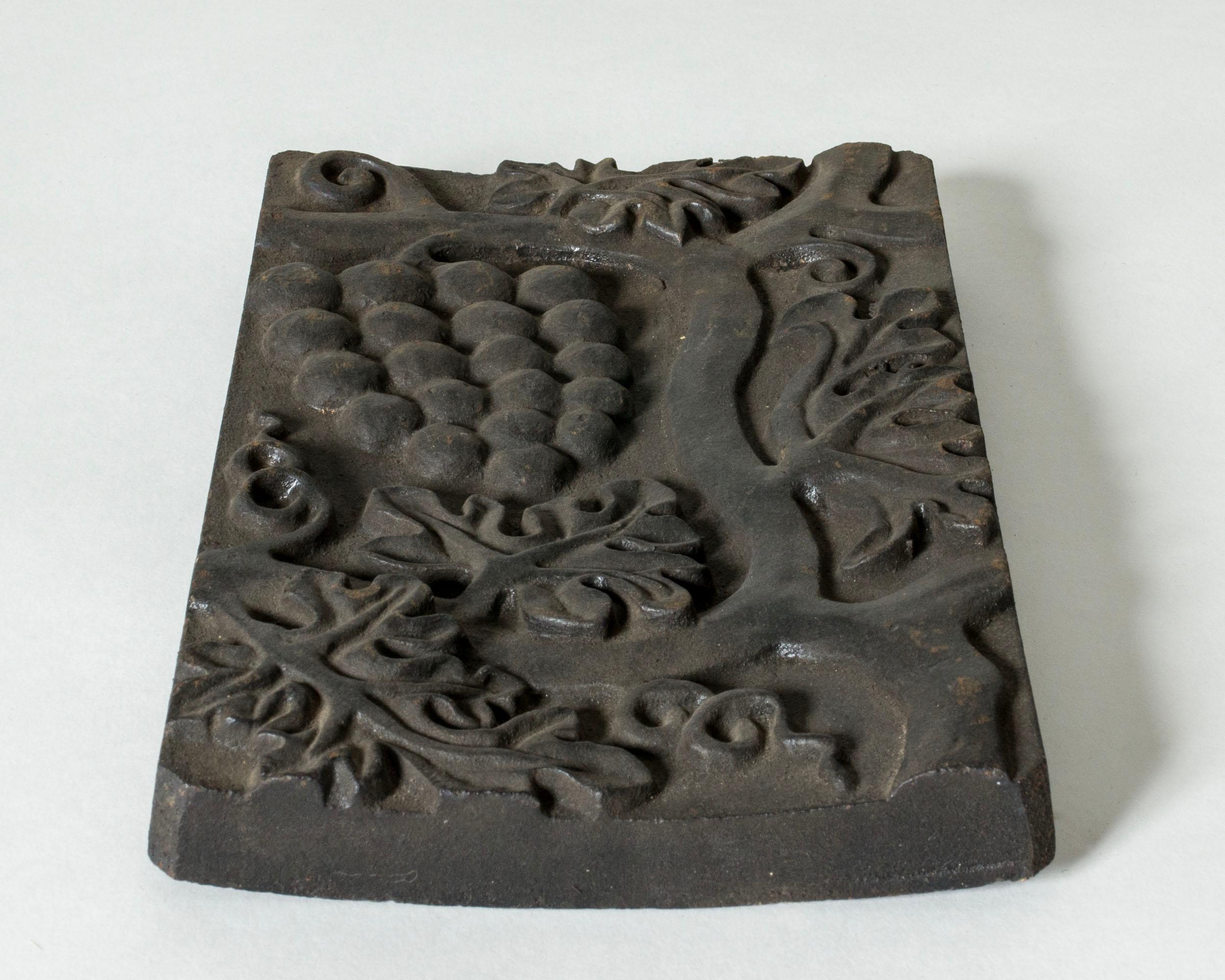 Striking relief by Anna Petrus, made from cast iron. Beautiful motif of grapes on a vine.

Anna Petrus was a Swedish sculptor, industrial designer and dancer with a unique, powerful artistic expression, renowned for her designs for Svenskt Tenn. She