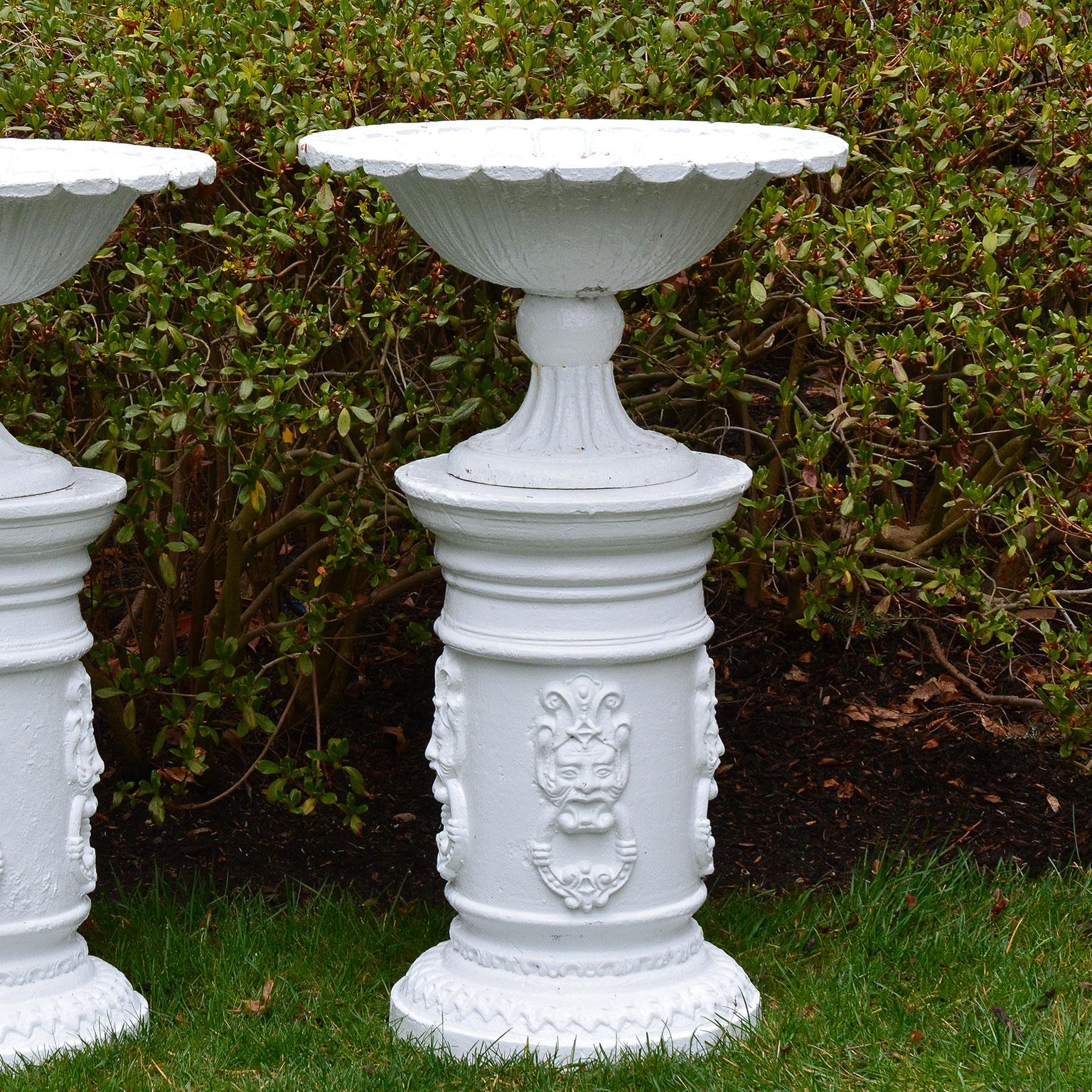 Neoclassical White Painted Cast-Iron Urns on White Pedestals
