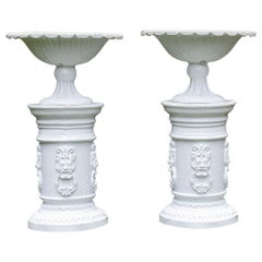 White Painted Cast-Iron Urns on White Pedestals