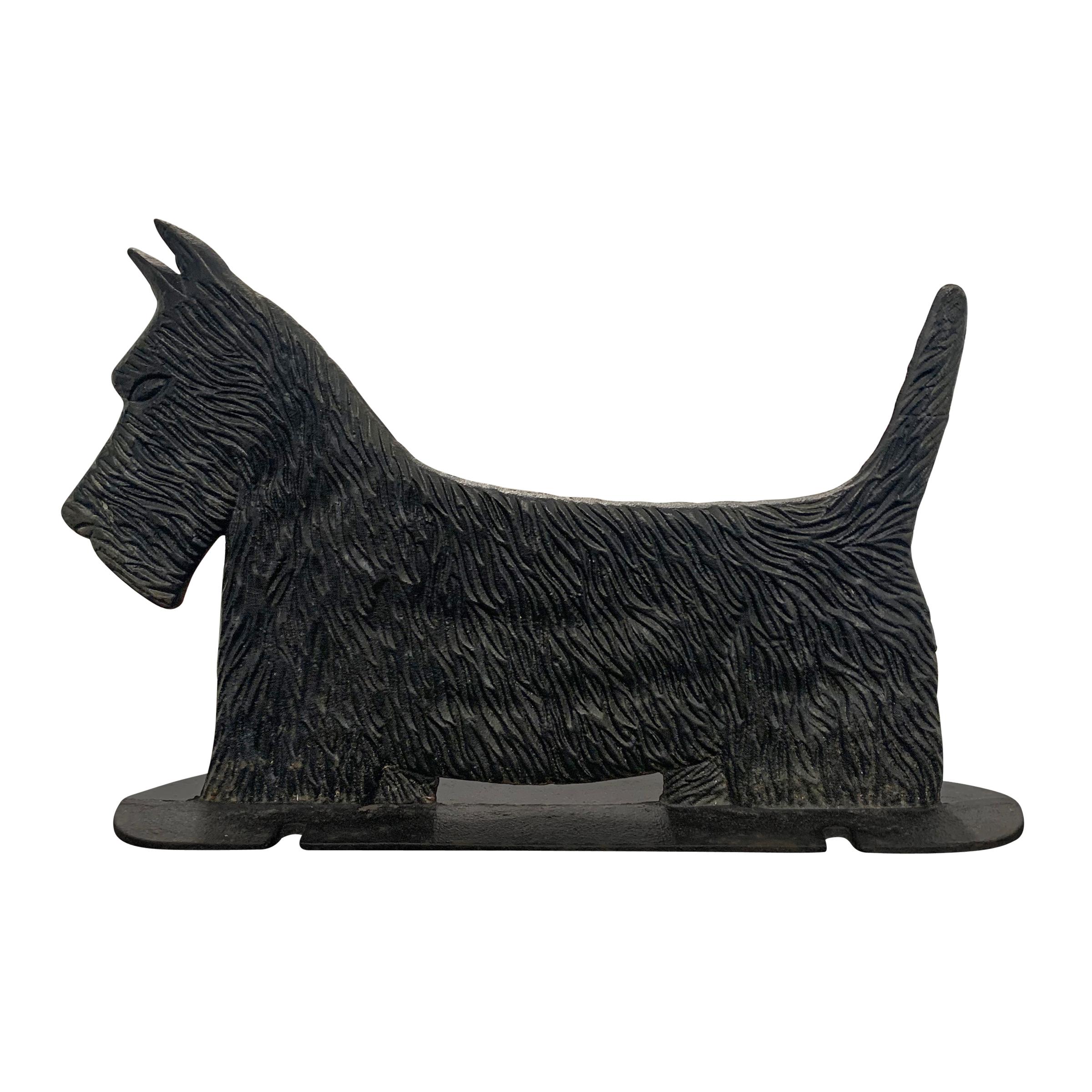 A wonderfully whimsical early 20th century American cast iron Scottish Terrier bootscrape with a fantastic fur texture and strong silhouette. Notice the notches to the base--these were originally used to attach the scrape to a pavement surface in